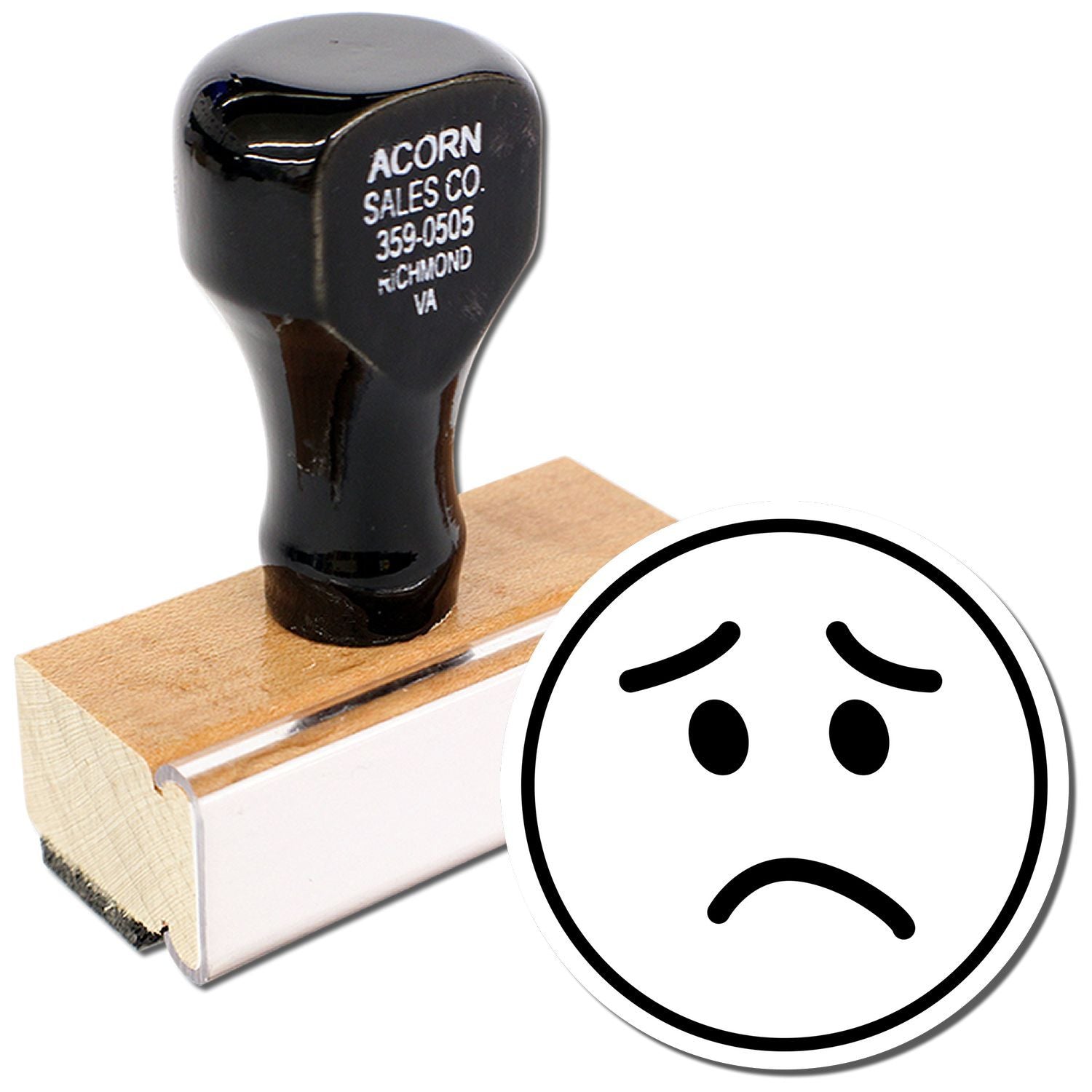 Sad face self-inking rubber stamp with black handle and wooden base for office use