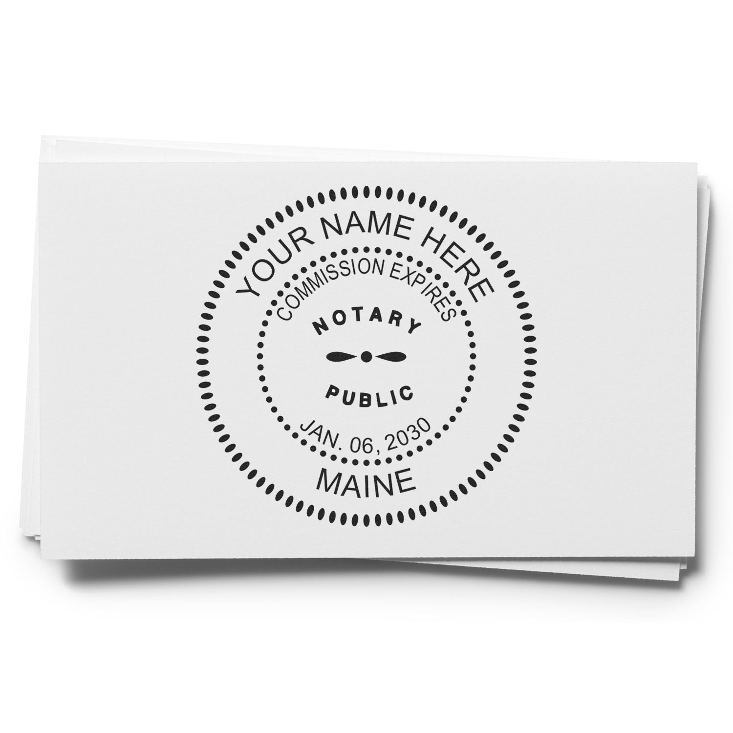 Maine notary public seal stamp on paper with commission expiration date and Your Name Here placeholder text.