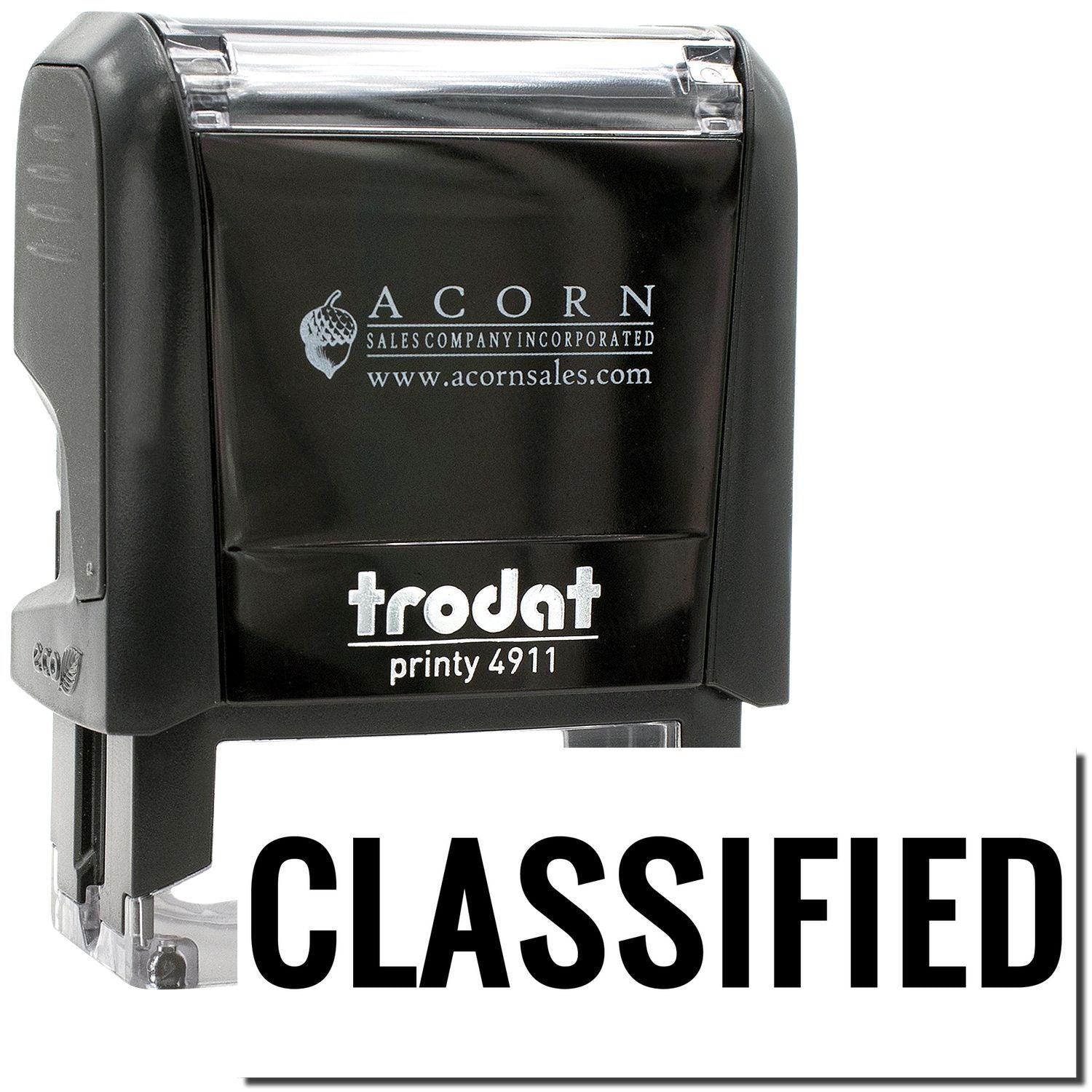 Trodat Printy 4911 classified self-inking stamp in black, Acorn Sales office stamp close-up.