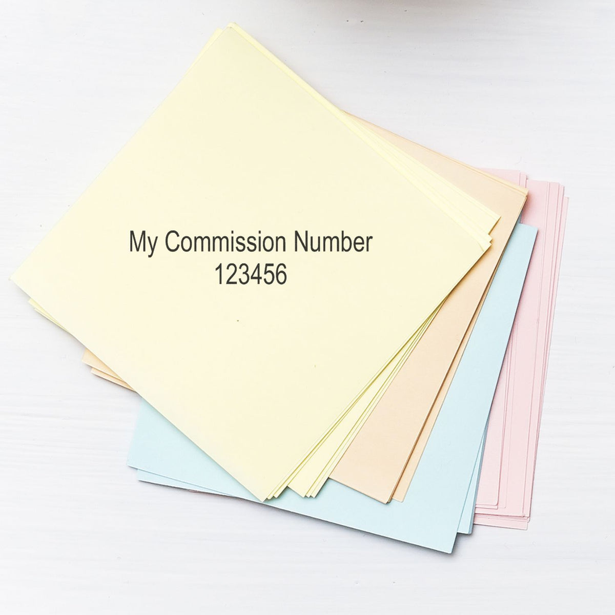 Pastel file folders labeled My Commission Number 123456 on a white background.