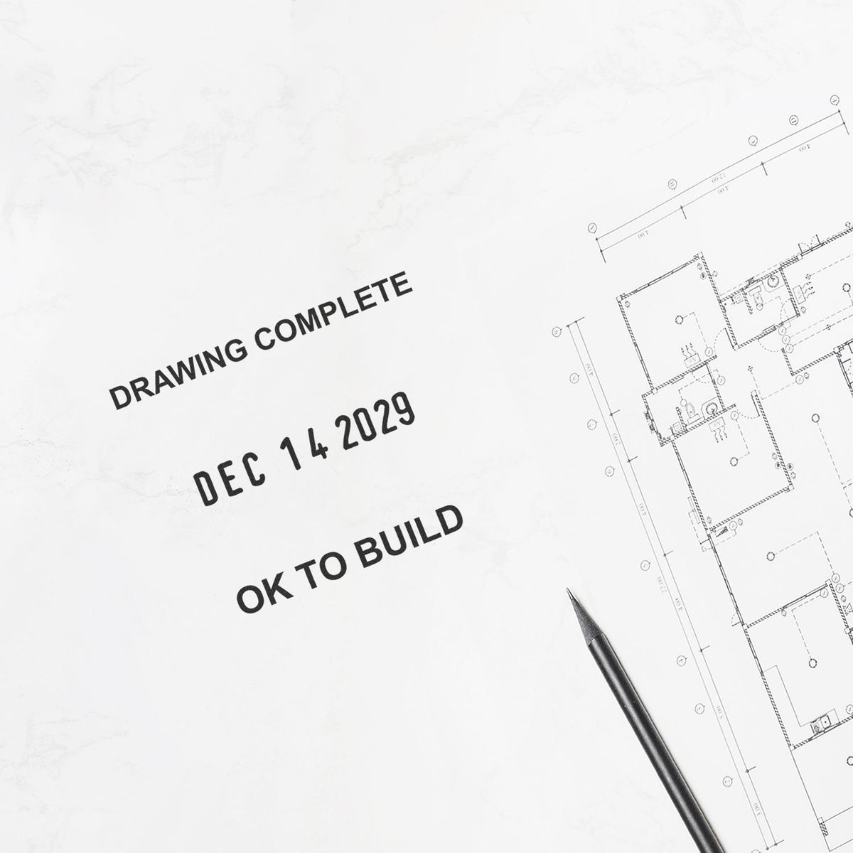 Architectural blueprint marked drawing complete and OK to build with pencil on plan drawings.