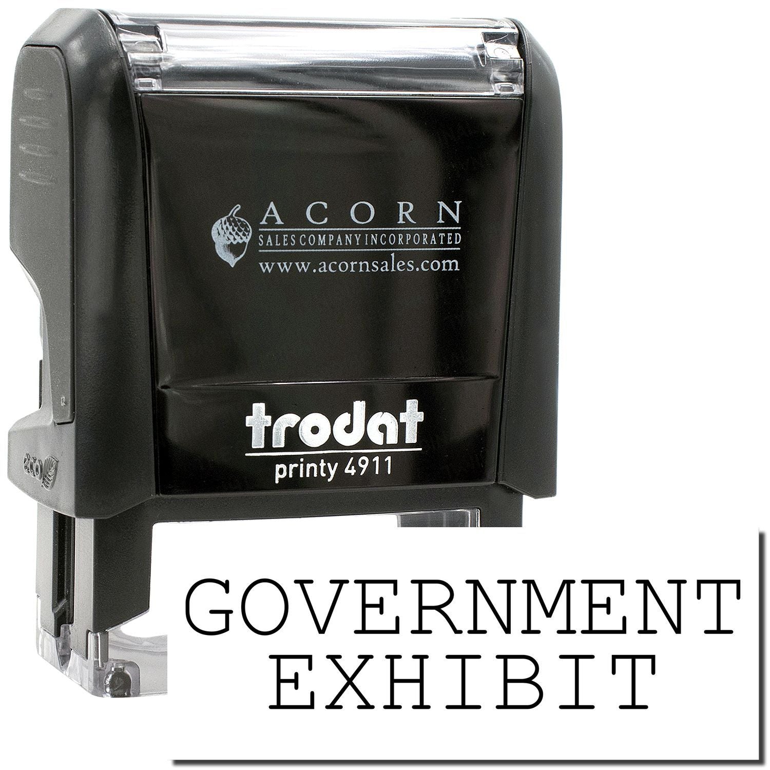 Black Trodat Printy 4911 self-inking stamp with Government Exhibit imprint, Acorn Sales logo, and clear casing.