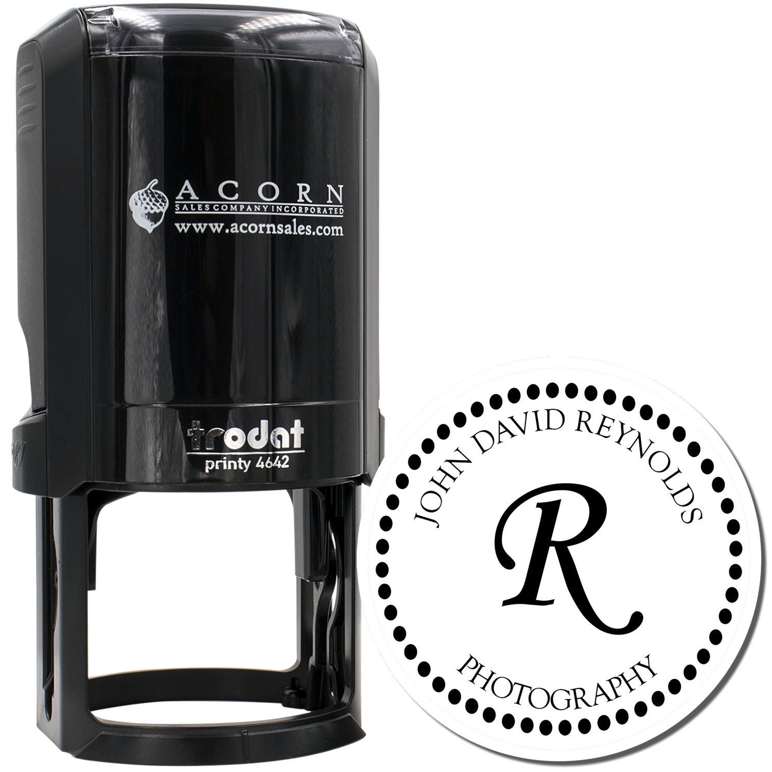 Custom self-inking rubber stamp with circular monogram logo, ideal for personalized branding and business use.