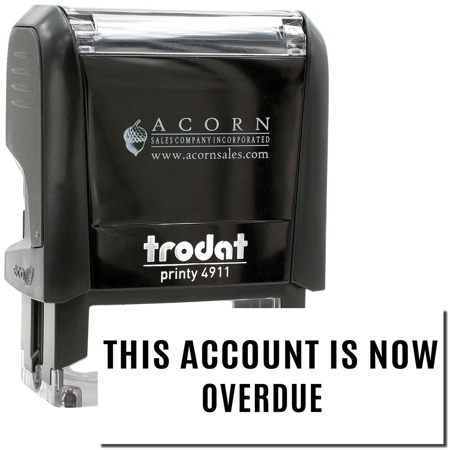 Black self-inking overdue stamp reading THIS ACCOUNT IS NOW OVERDUE for office billing and accounting use