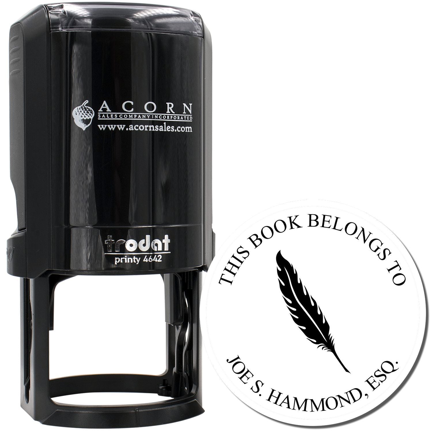 Custom self-inking rubber stamp with feather bookplate design for personal library books, shown with Trodat stamp imprint.