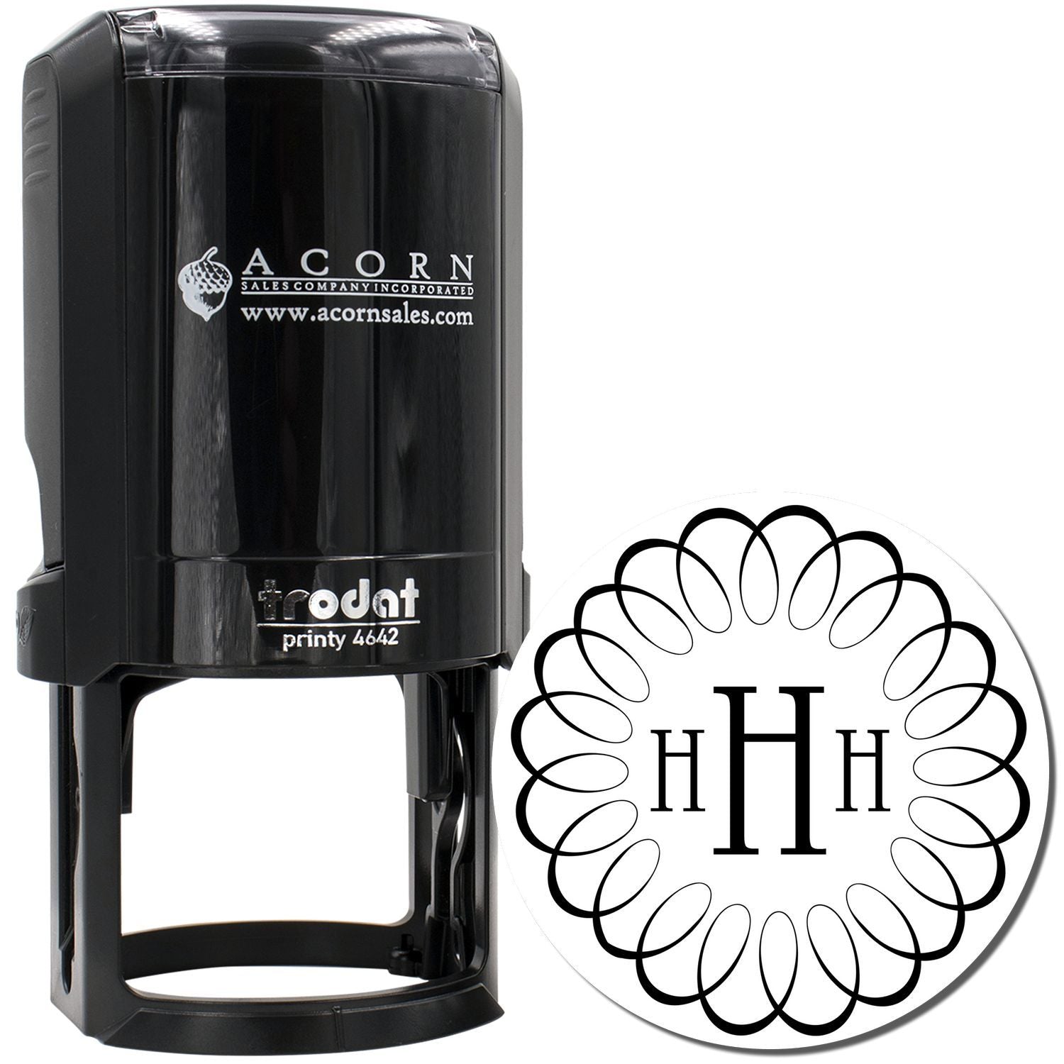 Custom self-inking monogram rubber stamp with decorative initials, ideal for personalized branding and stationery.