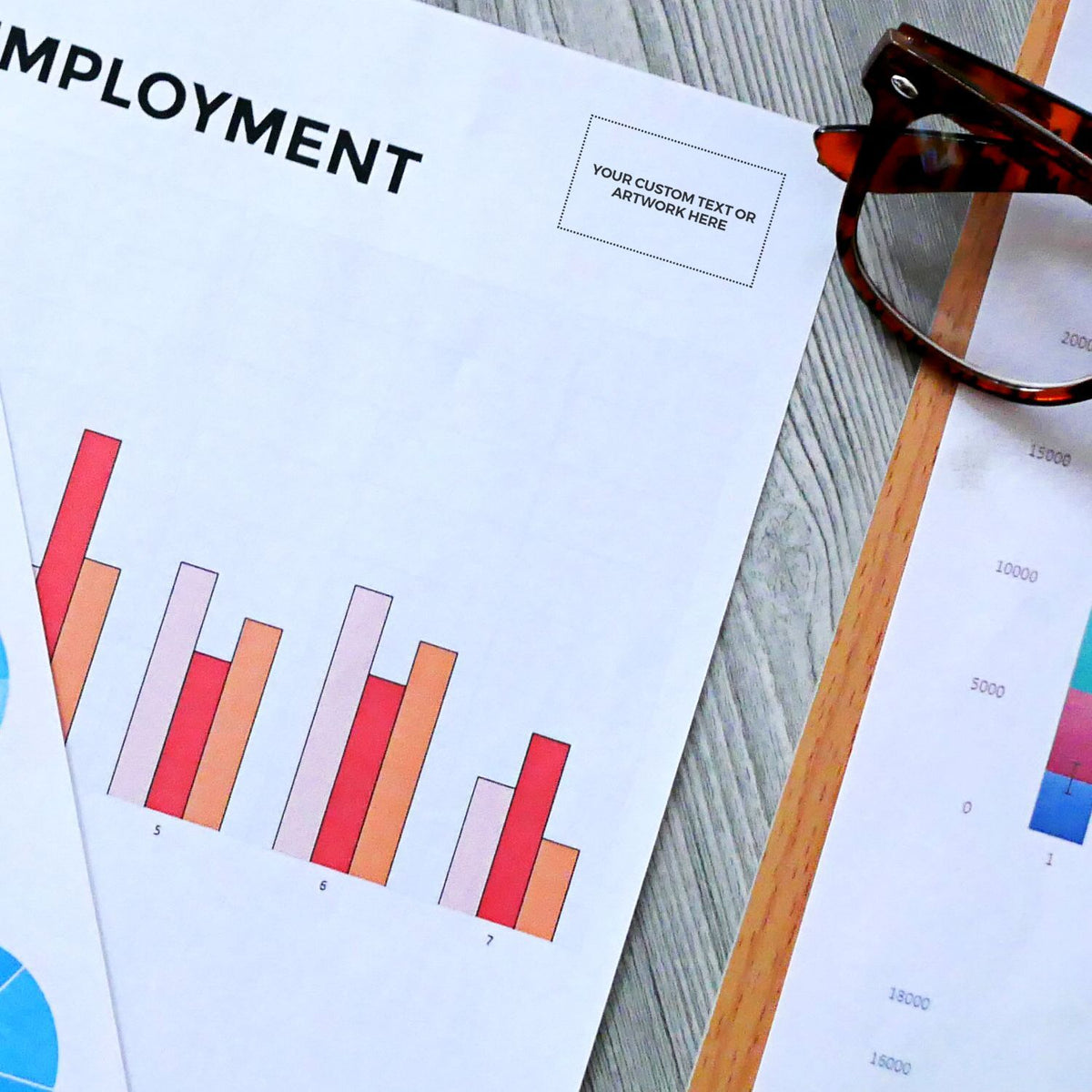 Employment report printout with colorful bar charts and tape measure, illustrating workforce metrics for HR performance analysis.