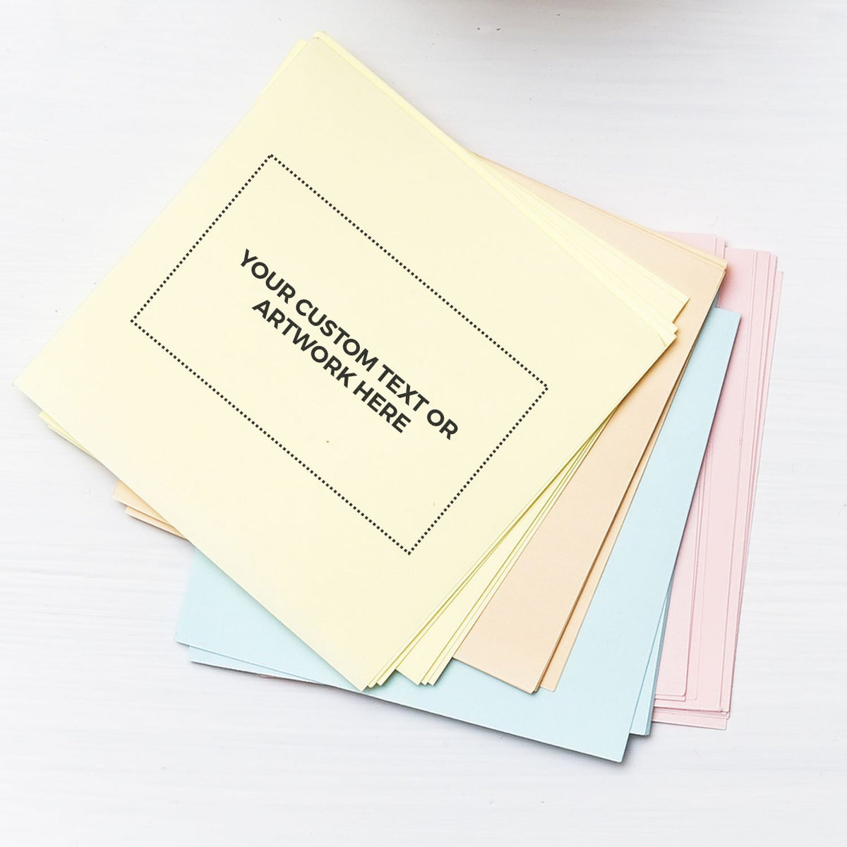 Stack of pastel greeting card templates with YOUR CUSTOM TEXT HERE placeholder for custom message printing and design mockup