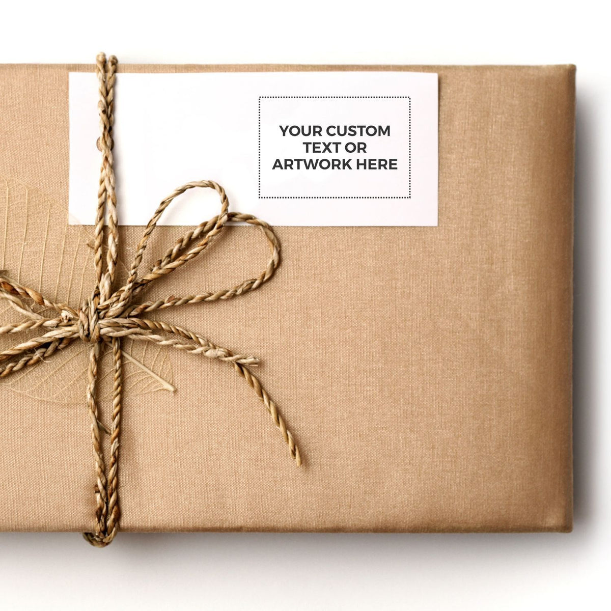 Customized kraft gift box with braided ribbon, featuring a label for custom text or artwork design placement