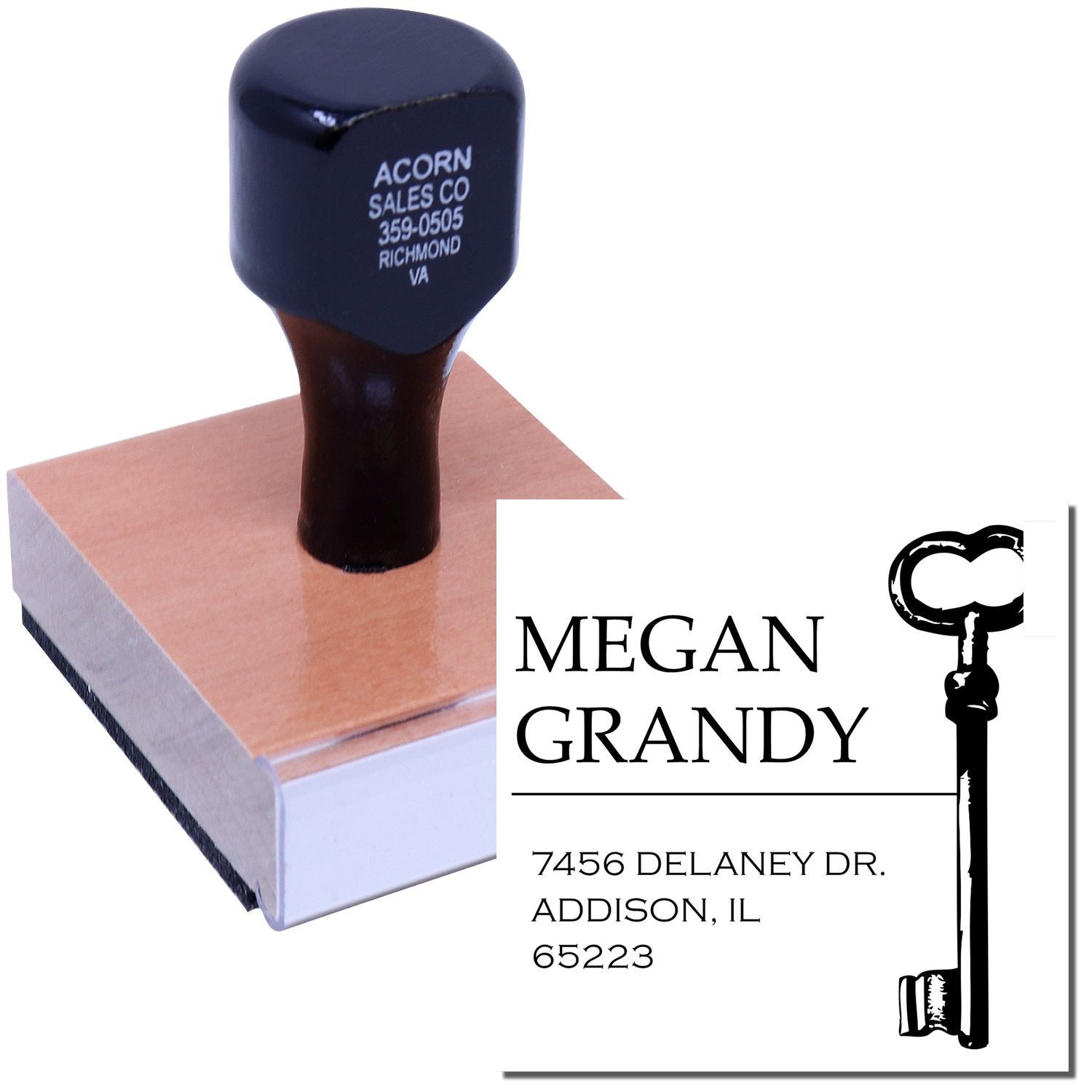 Custom return address rubber stamp with key design for Megan Grandy, ideal for personalized mail and business correspondence.