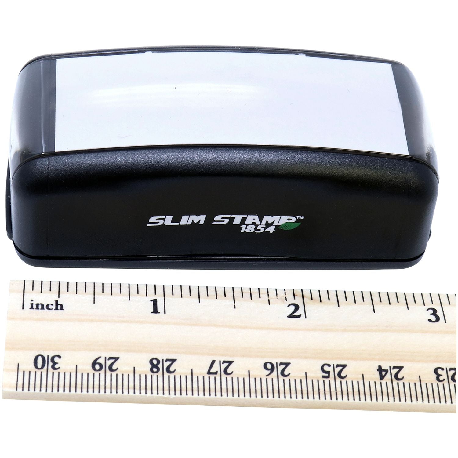 Slim Stamp 1854 dispenser shown with ruler for size comparison, highlighting compact stamp design.