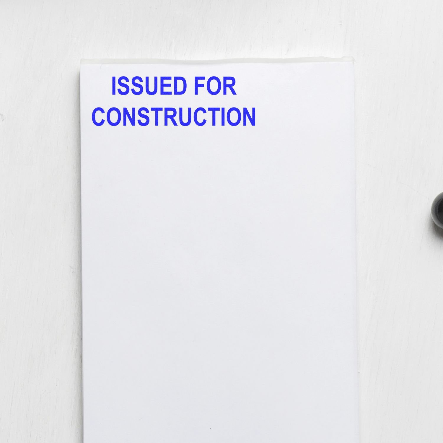 Issued for construction stamped on white engineering document, architectural blueprint form.