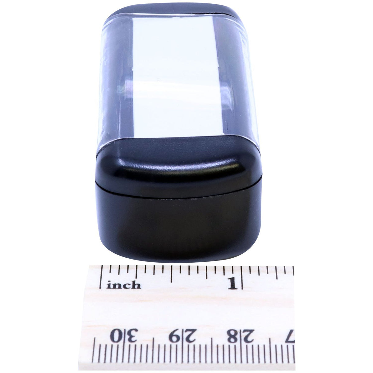 Compact black plastic device with clear window; size measurement shown in inches with a ruler for accurate product listing.