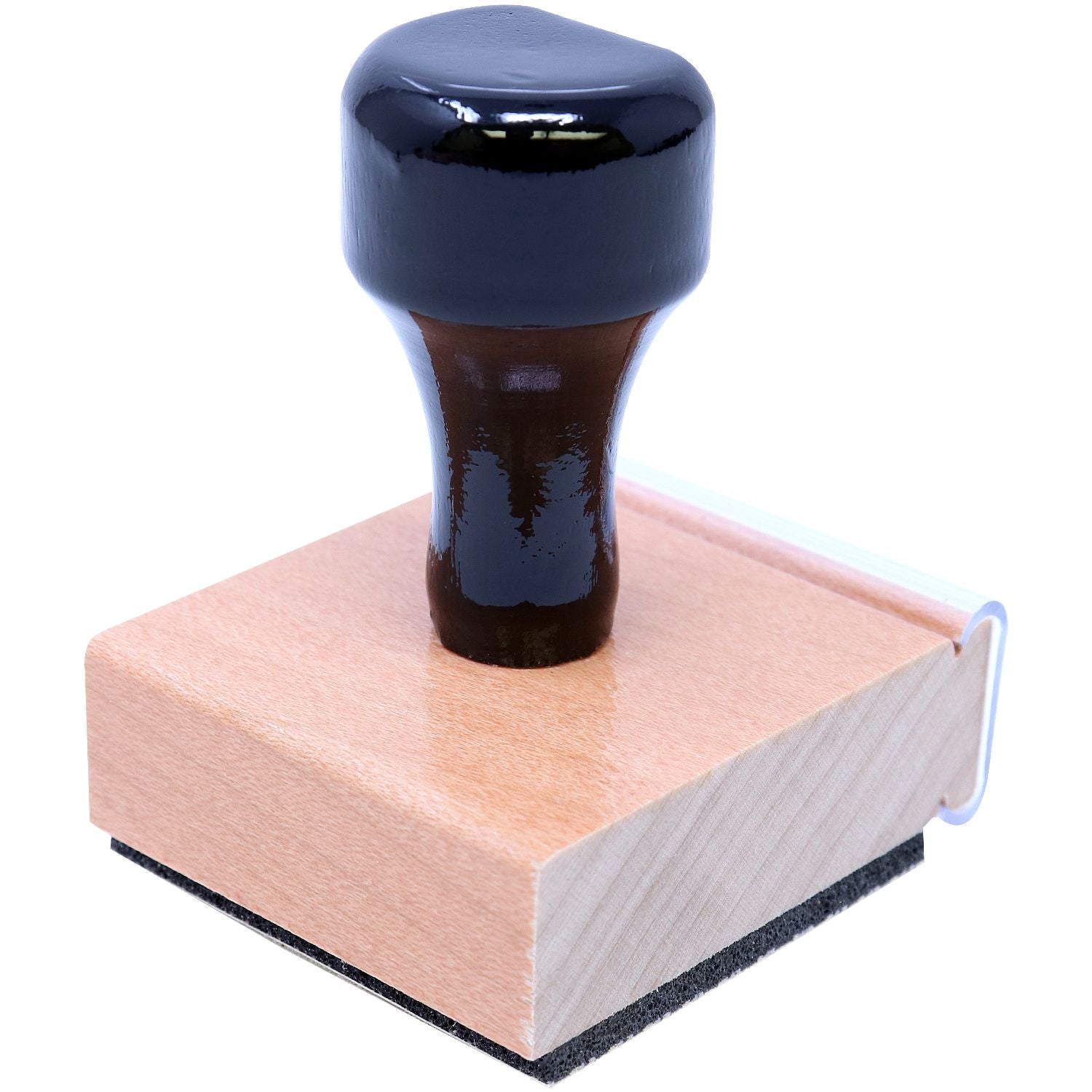 Close-up of a blue metal cylindrical knob mounted on a wooden base with foam backing, product detail for industrial use.