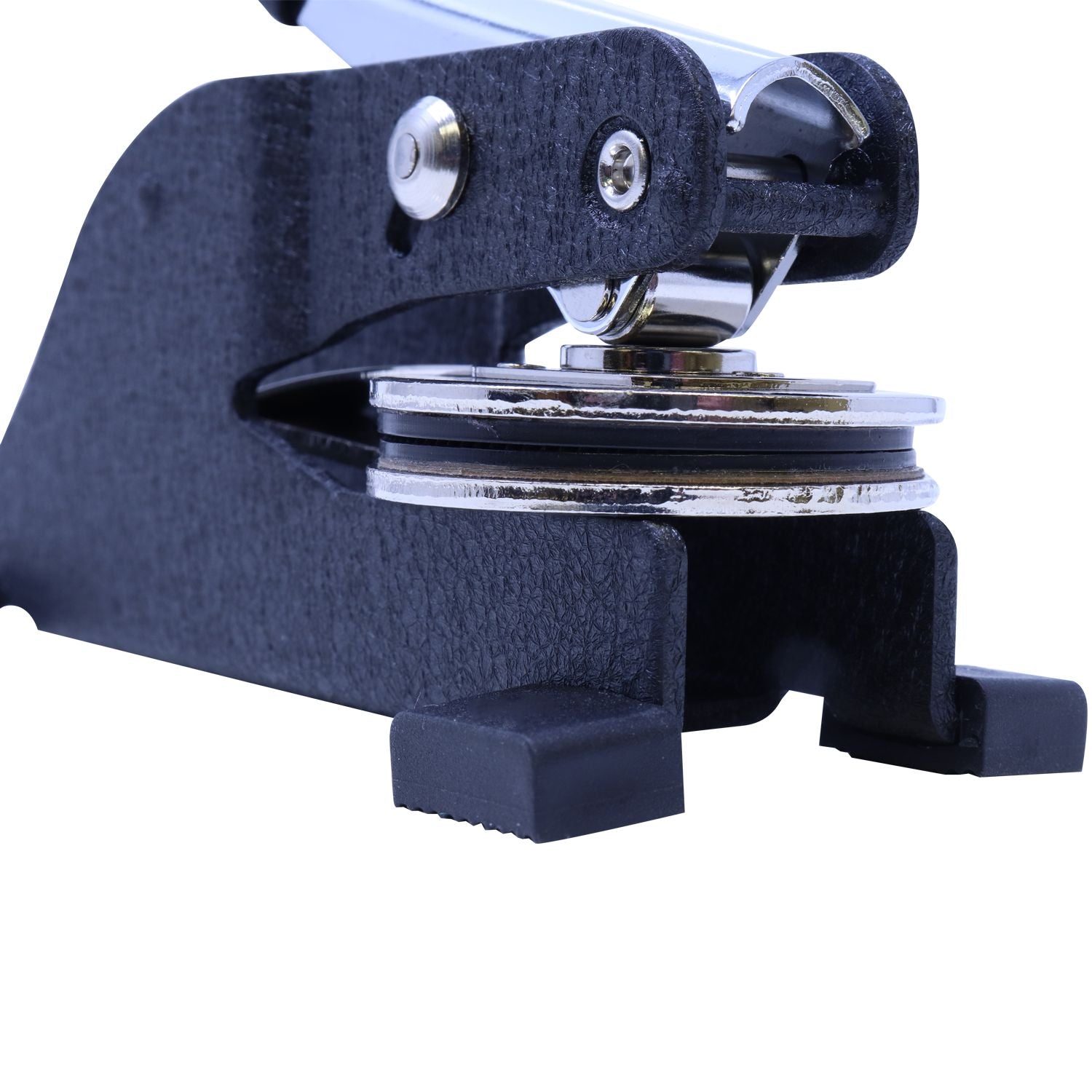 Close-up of a black heavy-duty metal hole punch machine with chrome components.