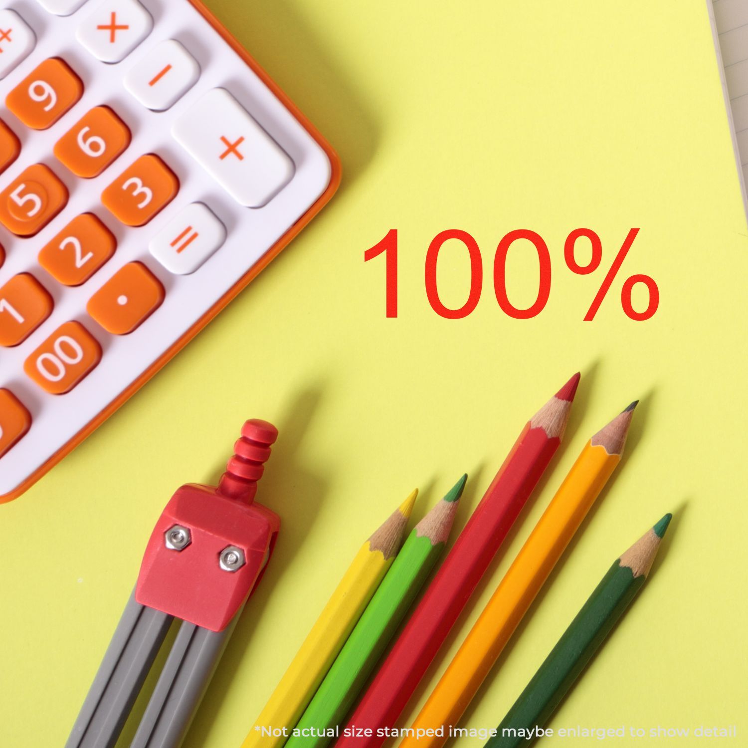 Calculator keypad, colored pencils and red 100% on a yellow background, symbolizing 100% accuracy in education and math.