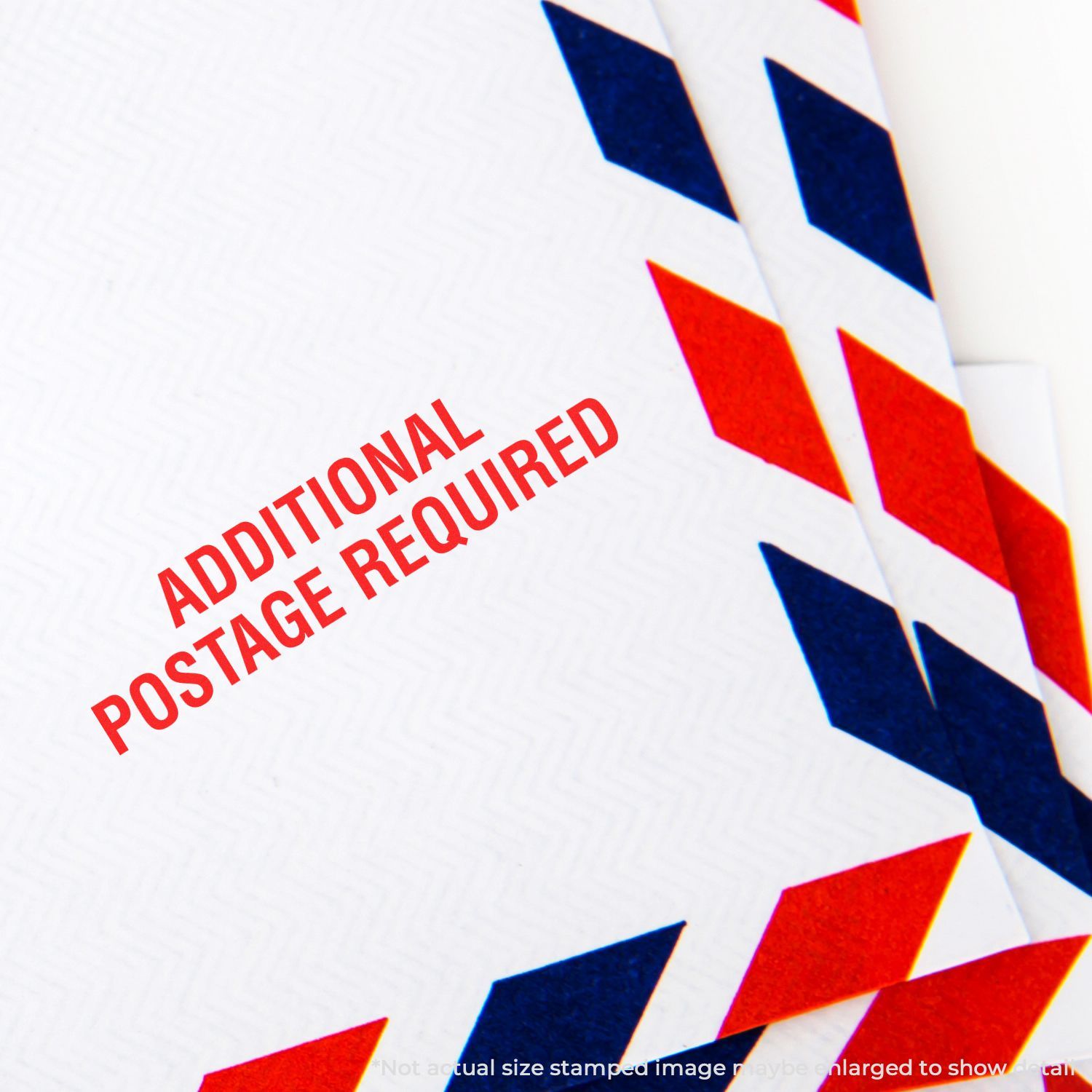 Additional Postage Required stamp over patriotic blue and red background, indicating extra mailing postage is needed.