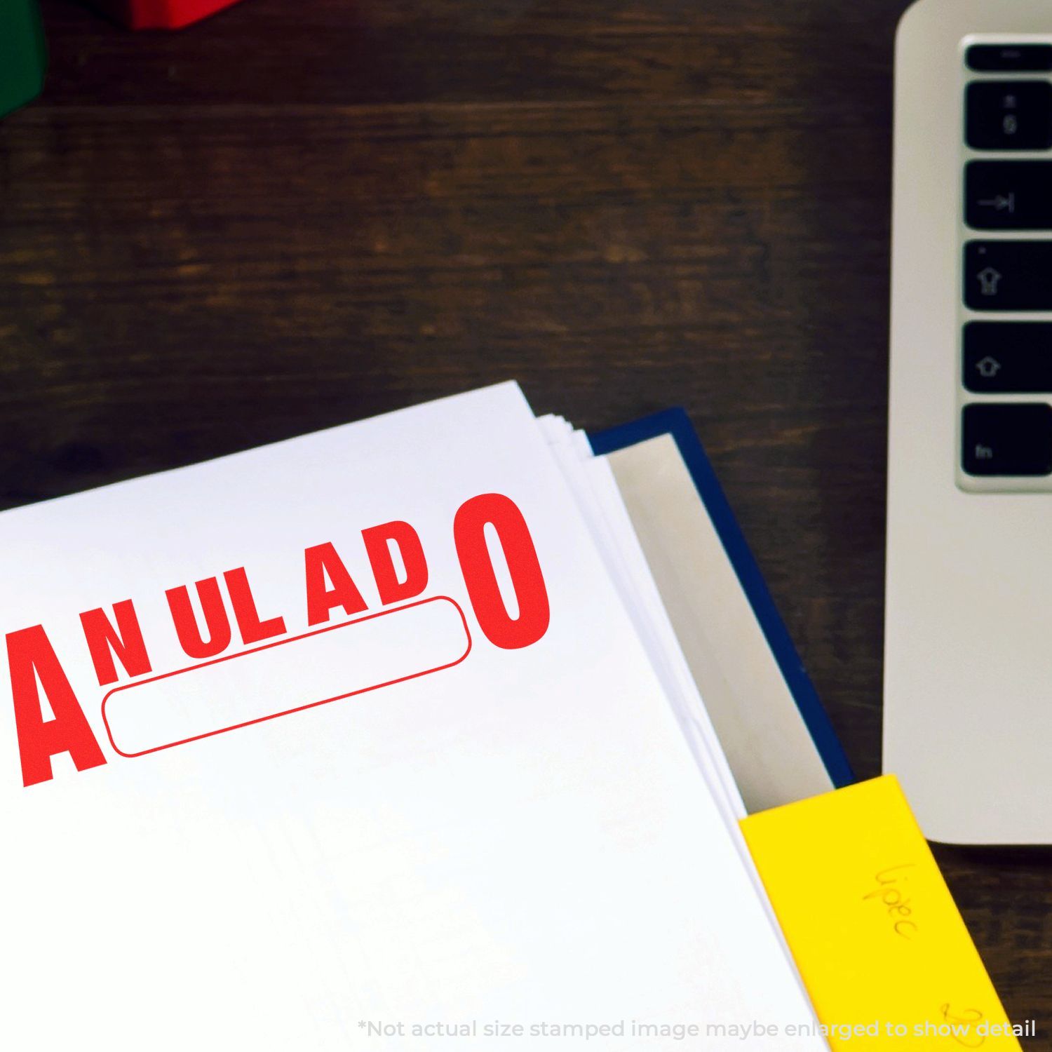 ANULADO canceled stamp on paperwork next to a computer, indicating legal document annulment and cancellation for audit records.