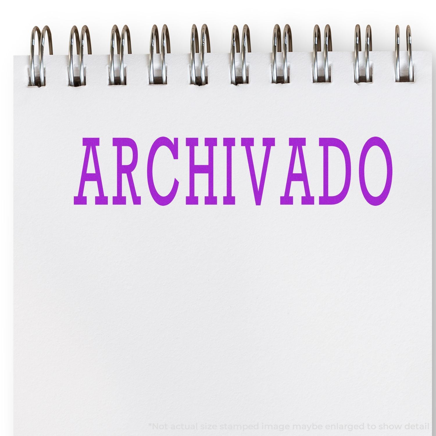 Archivado label with metal binder clips on white background, showing organized file storage and document archiving concept system.