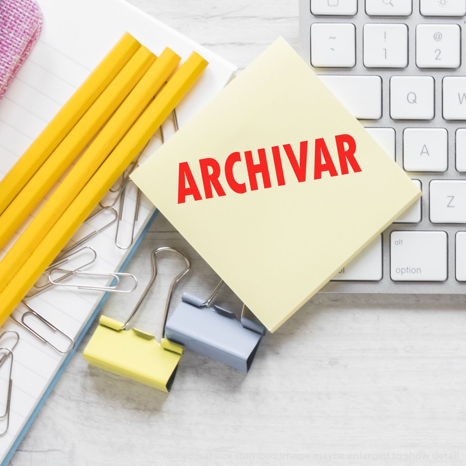 ARCHIVAR text on manila folder with stationery and keyboard, illustrating document filing, organization, and archiving workflow