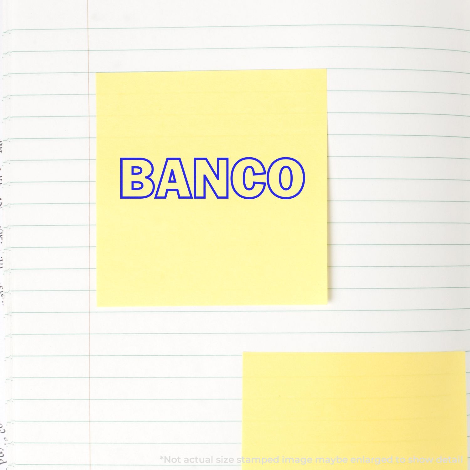 Yellow sticky note with BANCO on lined notebook paper background, minimalist office stationery design.