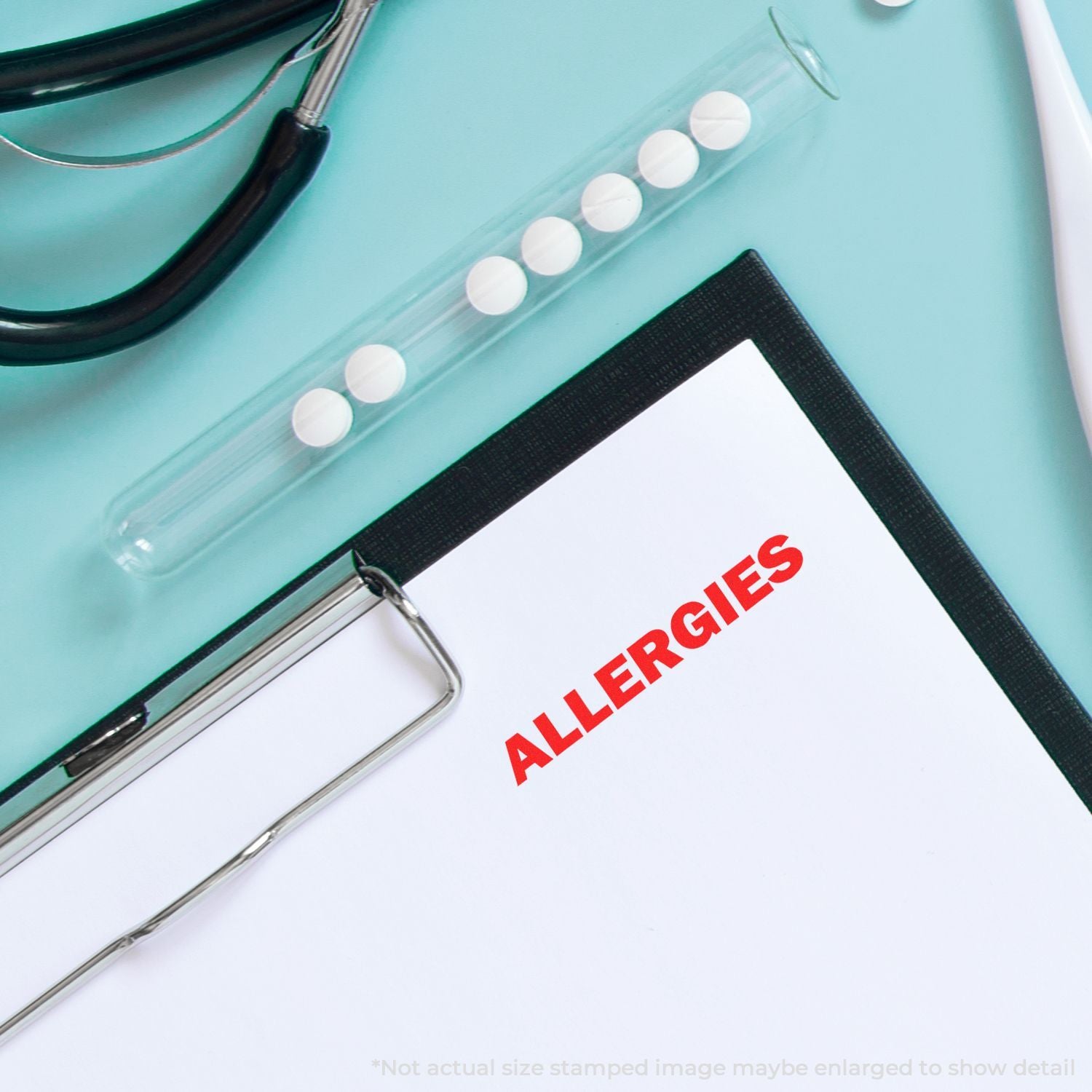 Close-up of allergy notebook labeled ALLERGIES with metal binder rings and pen, for allergy awareness and notes.
