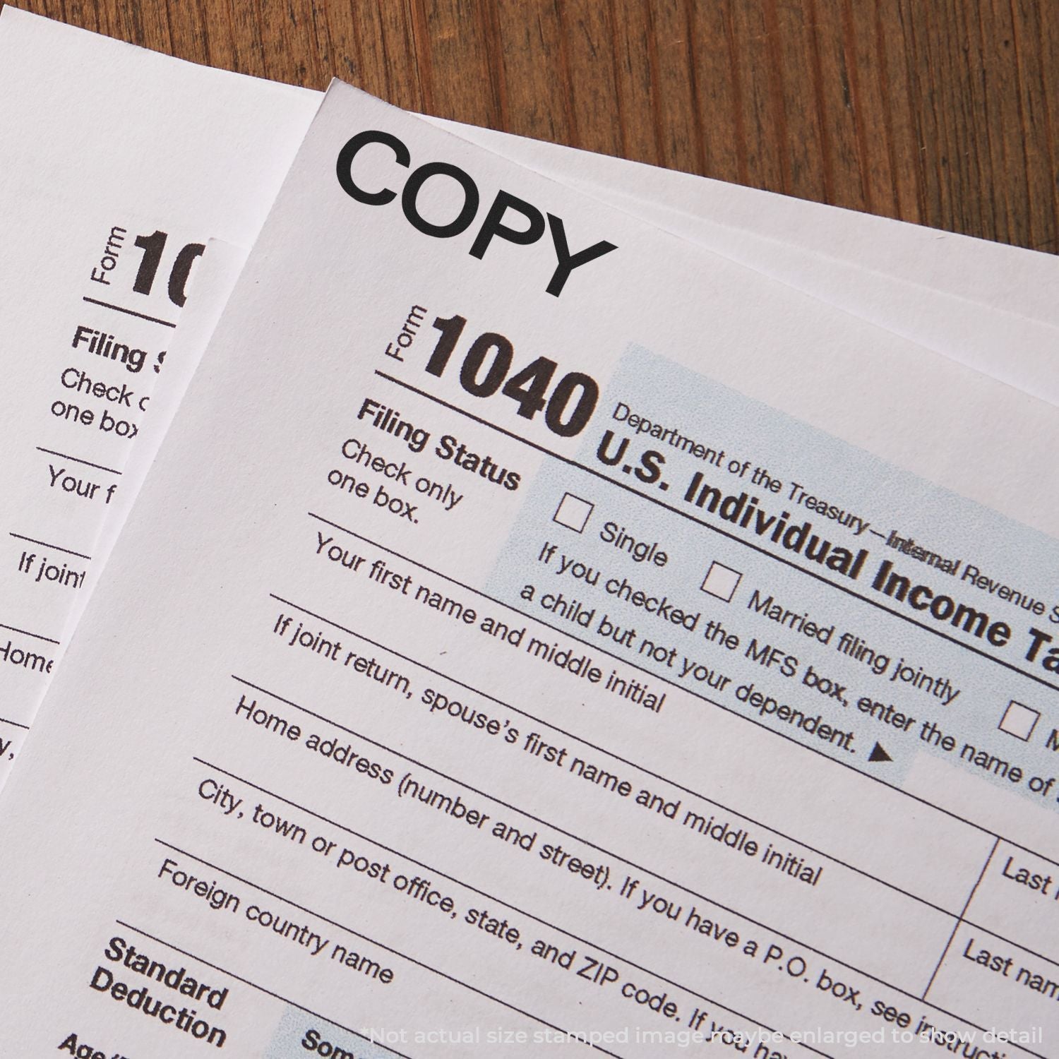 Close-up of IRS Form 1040 for filing U.S. individual income tax return, showing filing status and personal info fields.