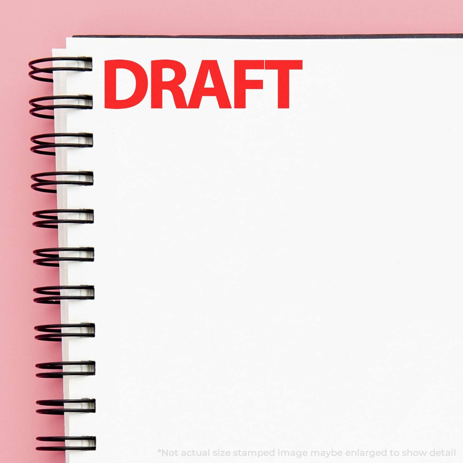 Draft notebook with red DRAFT label on a white page, symbolizing writing and editing process