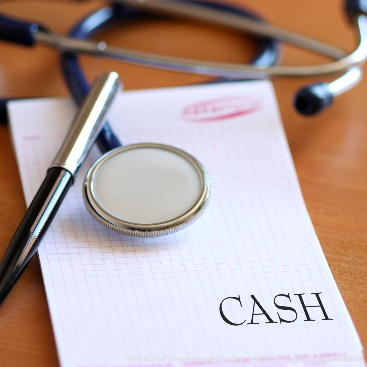 Stethoscope and pen on a cash notepad, healthcare billing and payment concept