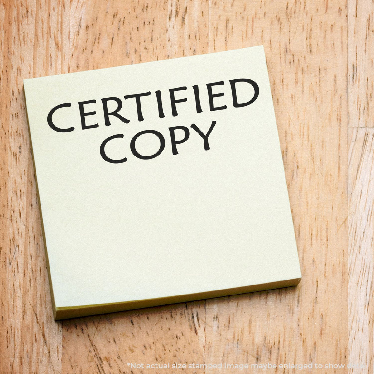Certified copy document note on a wooden desk showing CERTIFIED COPY text for legal verification and paperwork.