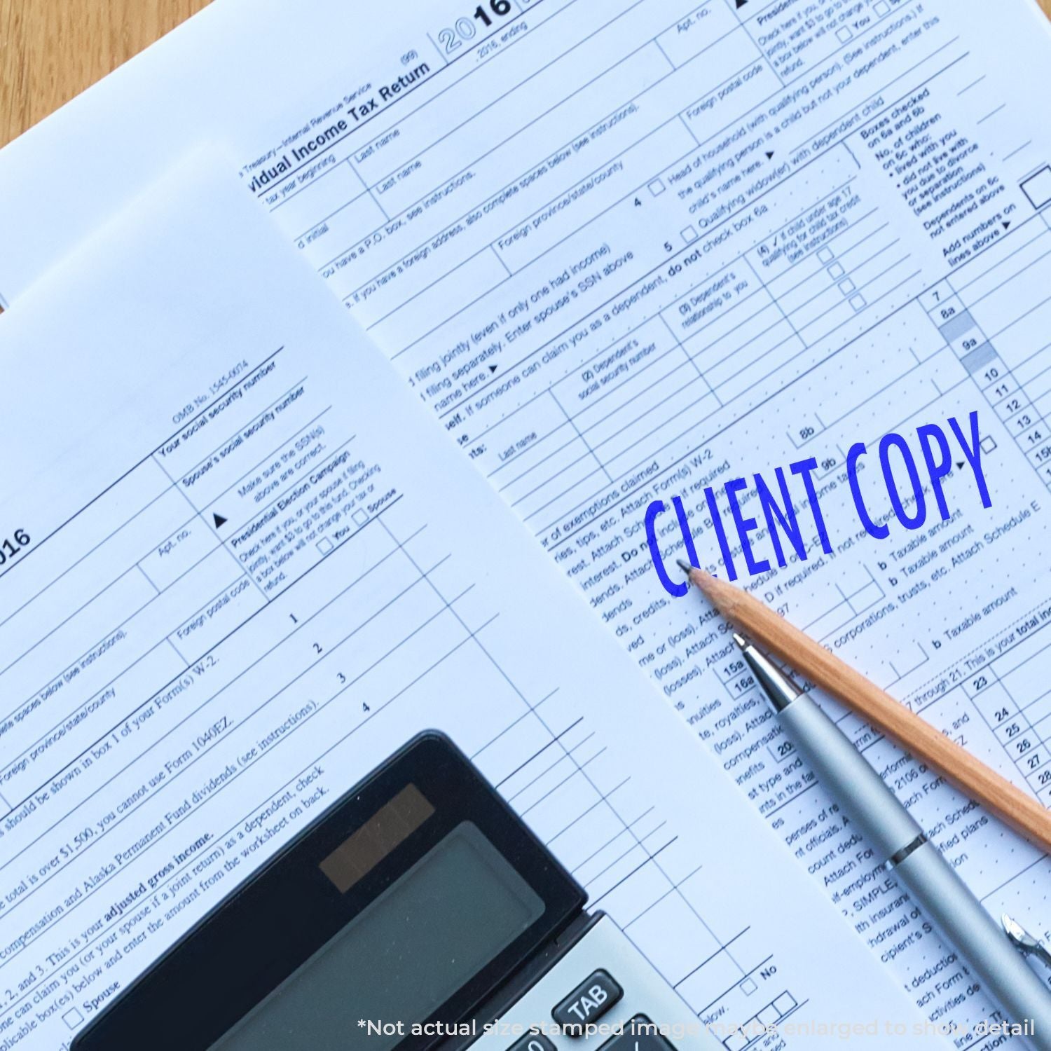 Income tax form with pen and calculator, highlighting tax return planning and filing accuracy in 2016 tax season.