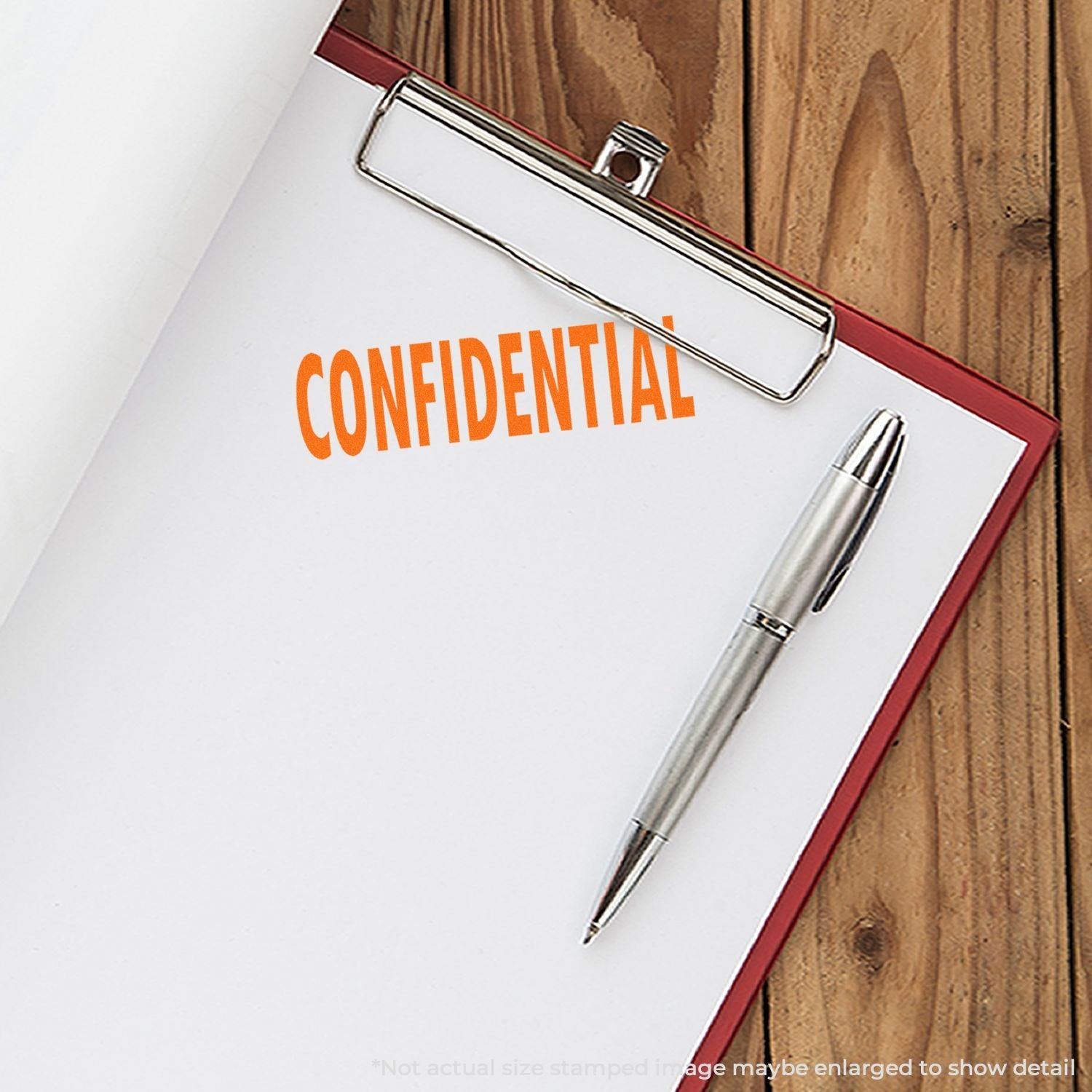 Confidential document on clipboard with pen on wooden desk, business privacy concept.