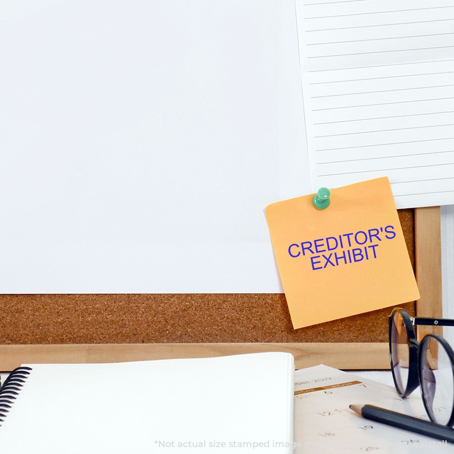 Creditors exhibit label pinned to a corkboard beside legal documents and office supplies, representing evidence for creditor claims