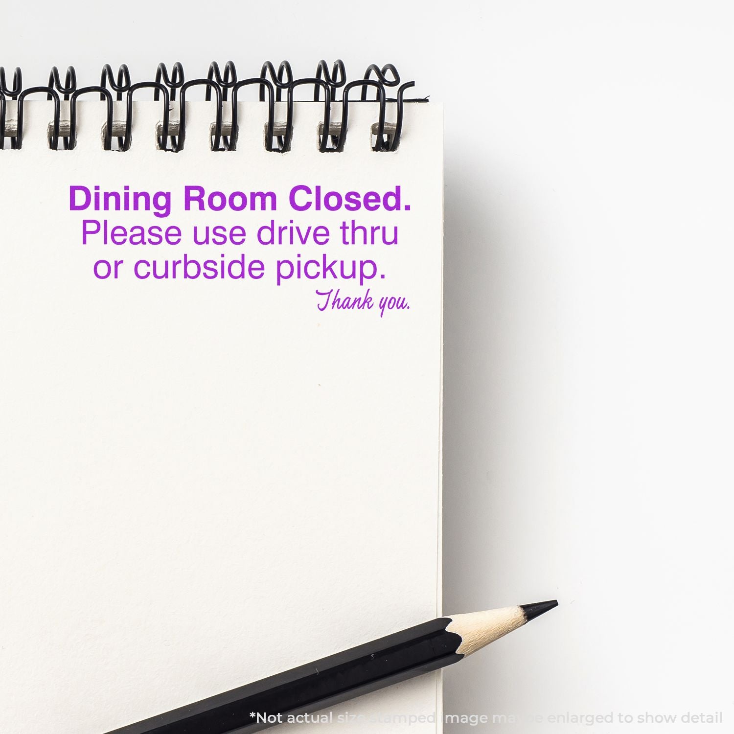 Restaurant dining room closed sign directing customers to use drive-thru or curbside pickup service.