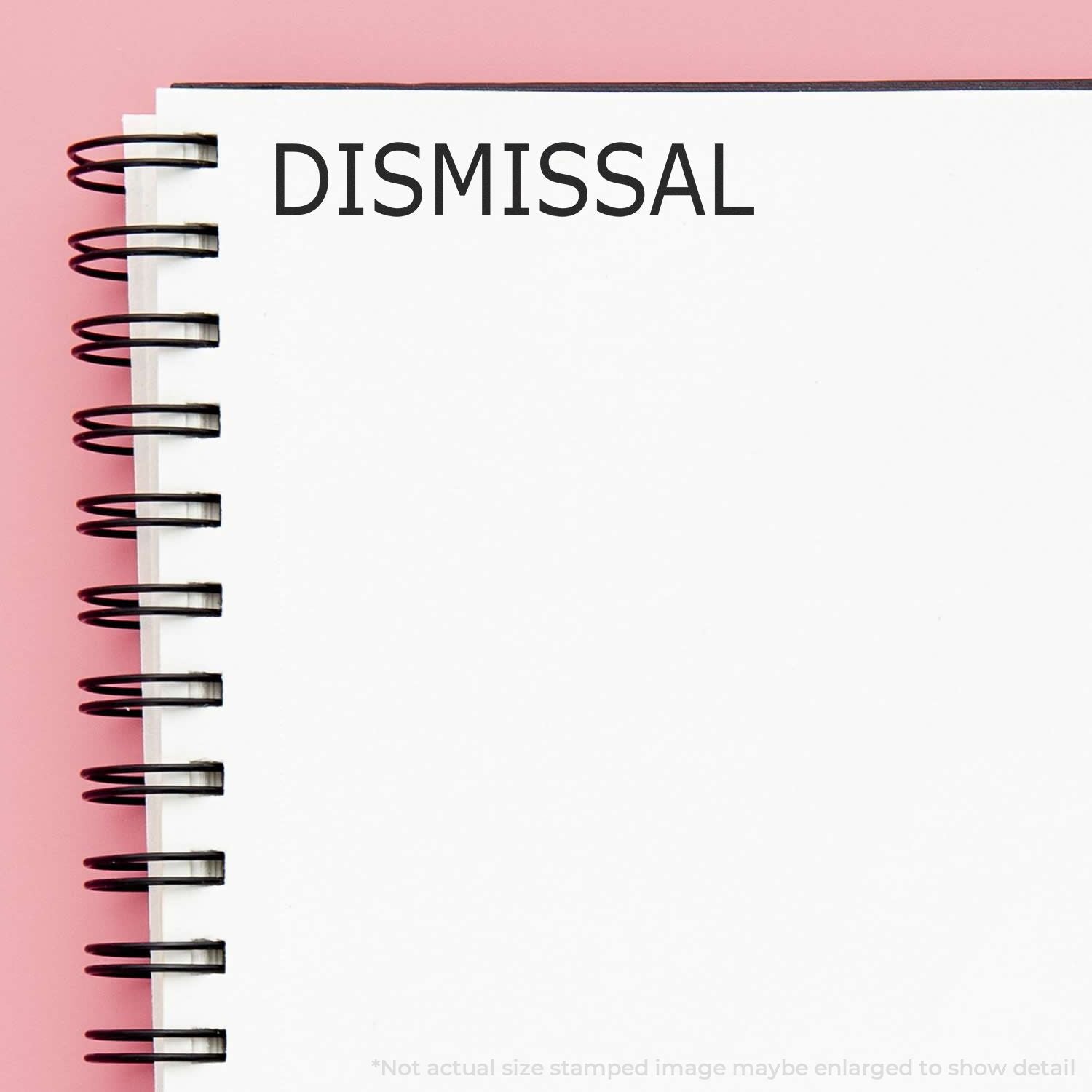 Dismissal concept on spiral notebook with DISMISSAL text, representing employment termination notice and HR documentation