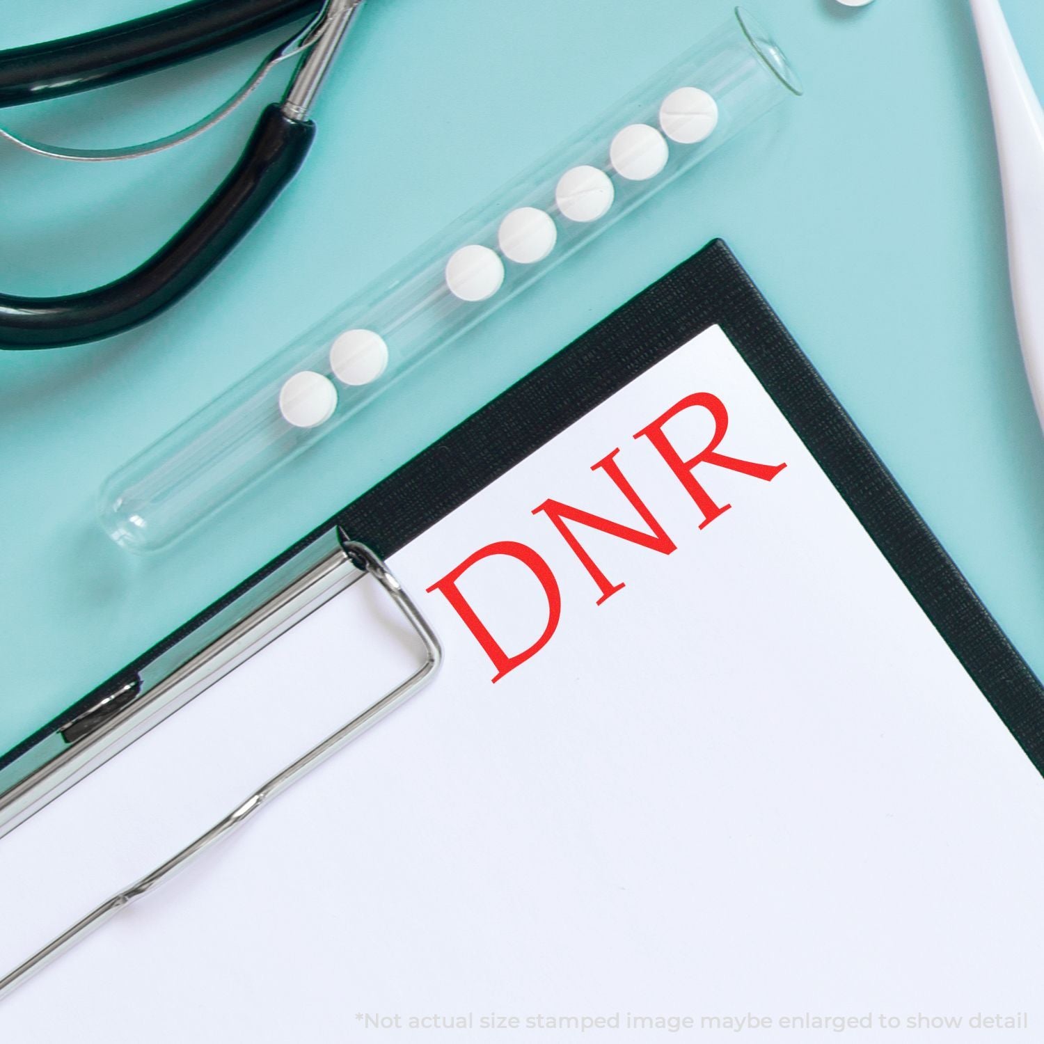 Close-up of notebook card marked DNR, symbolizing Do Not Resuscitate instructions for end-of-life care.