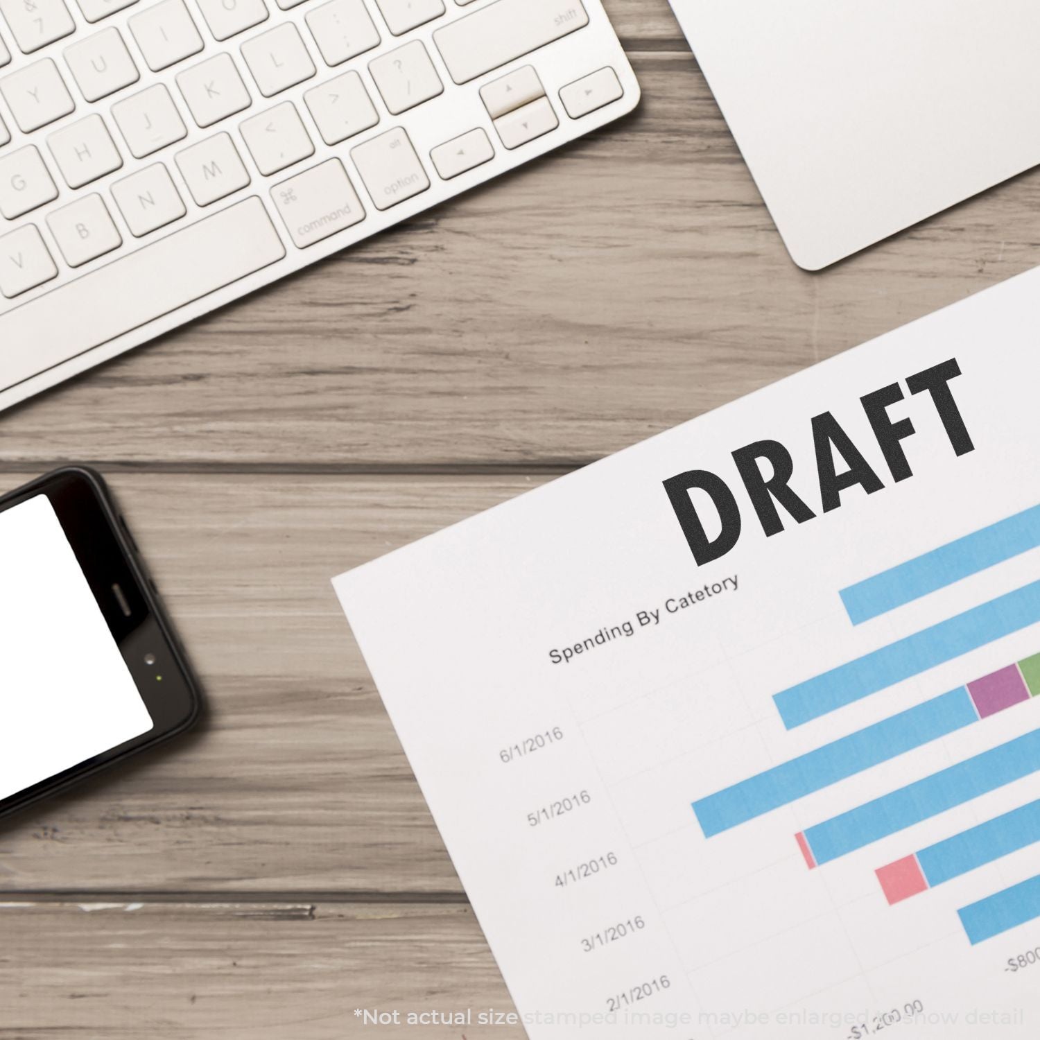 Draft financial report with bar chart on desk next to keyboard and smartphone in office workspace