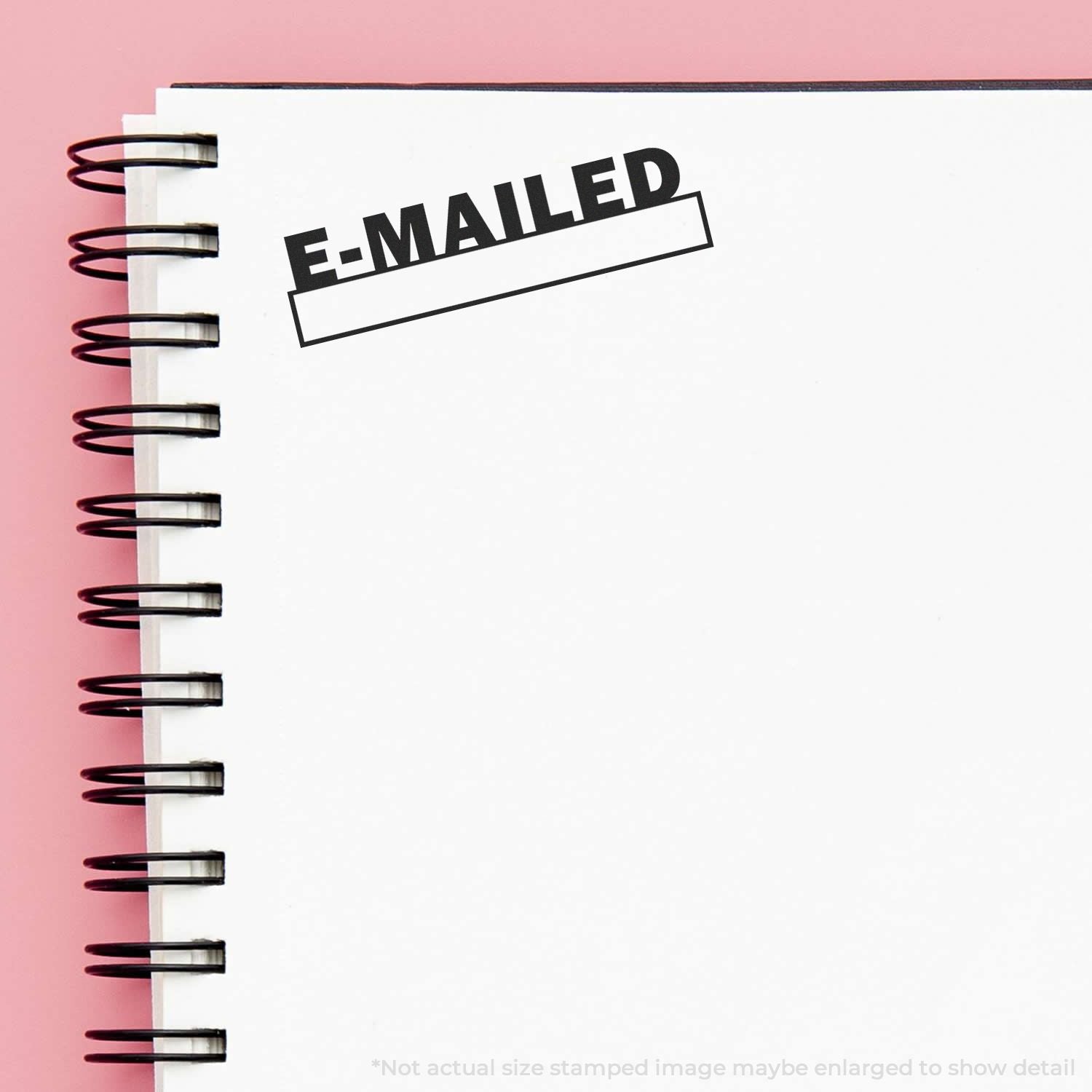 E-MAILED stamp on a spiral notebook, symbolizing email delivery and confirmed message sending for marketing and communication campaign.