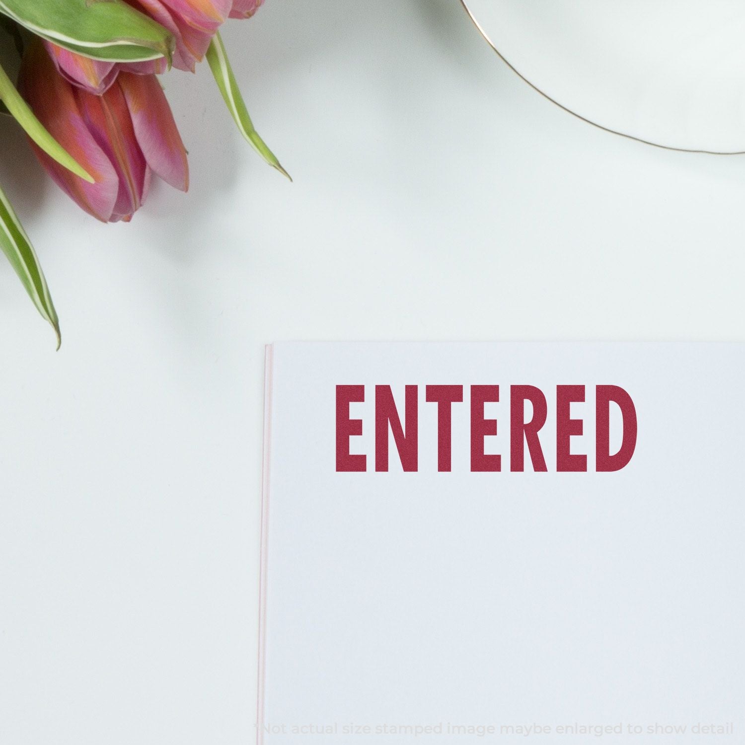 Minimal white greeting card reading ENTERED with pink protea flowers on the corner, clean invitation style background