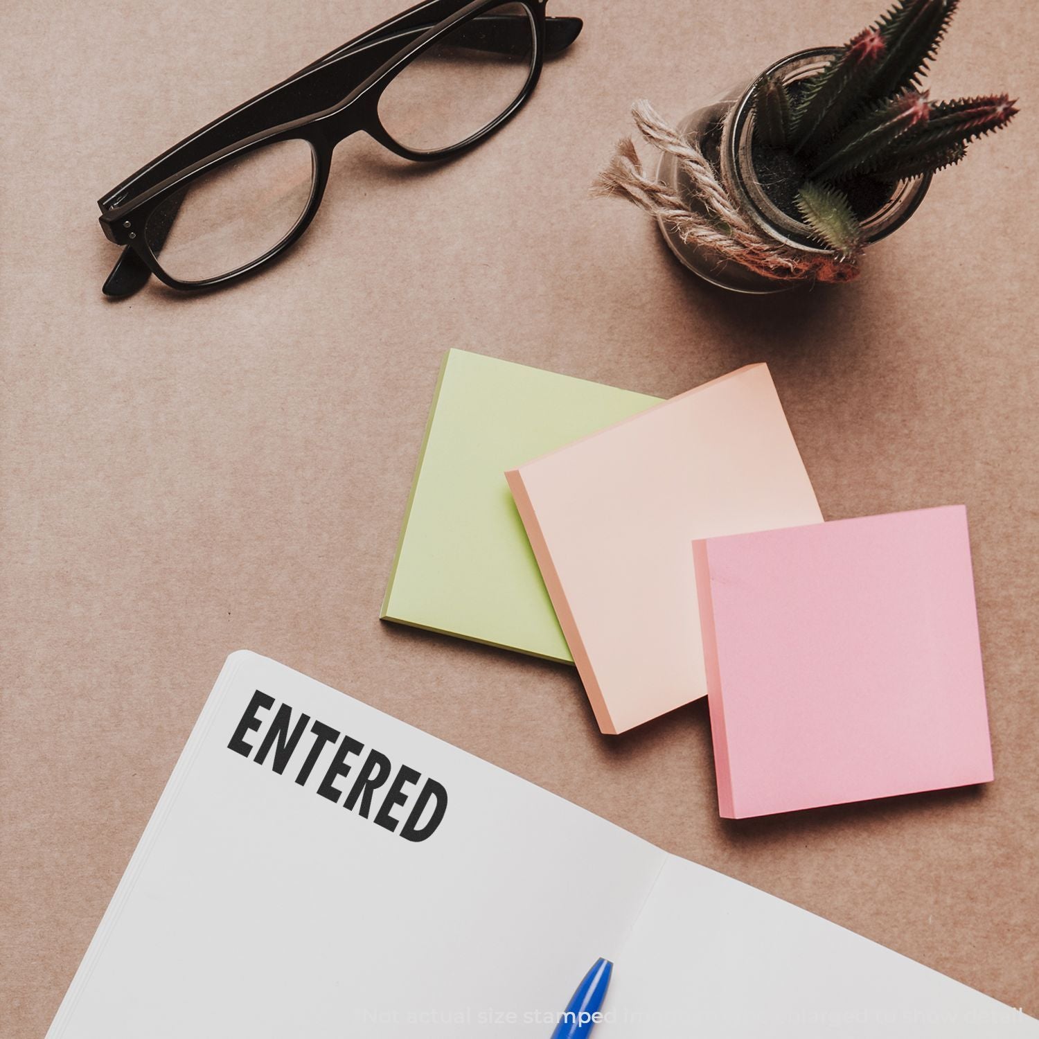 Flat lay of the ENTFRNED notebook, colorful note cards, black glasses and featherswriting and study editing concept SEO.