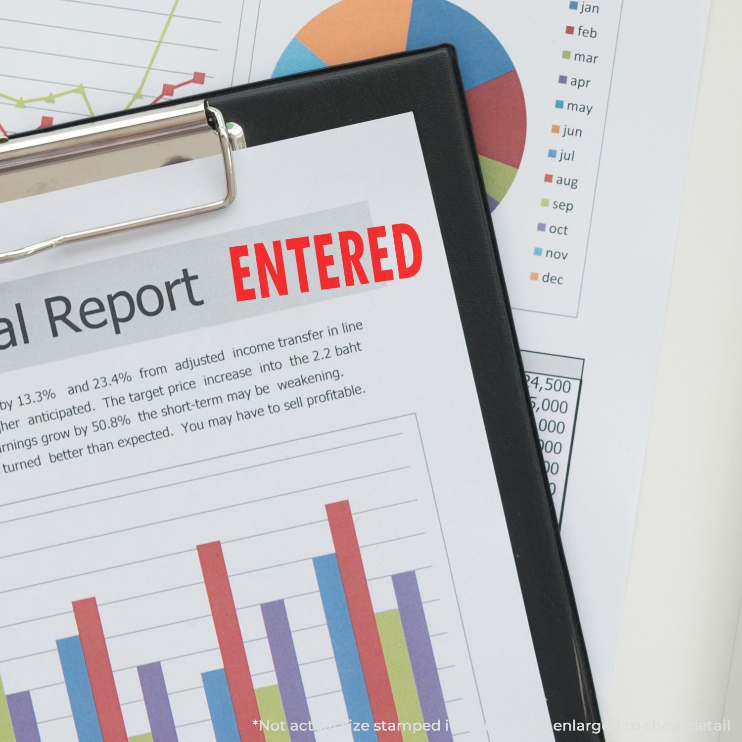 Financial report marked entered on clipboard with business charts and graphs in the background