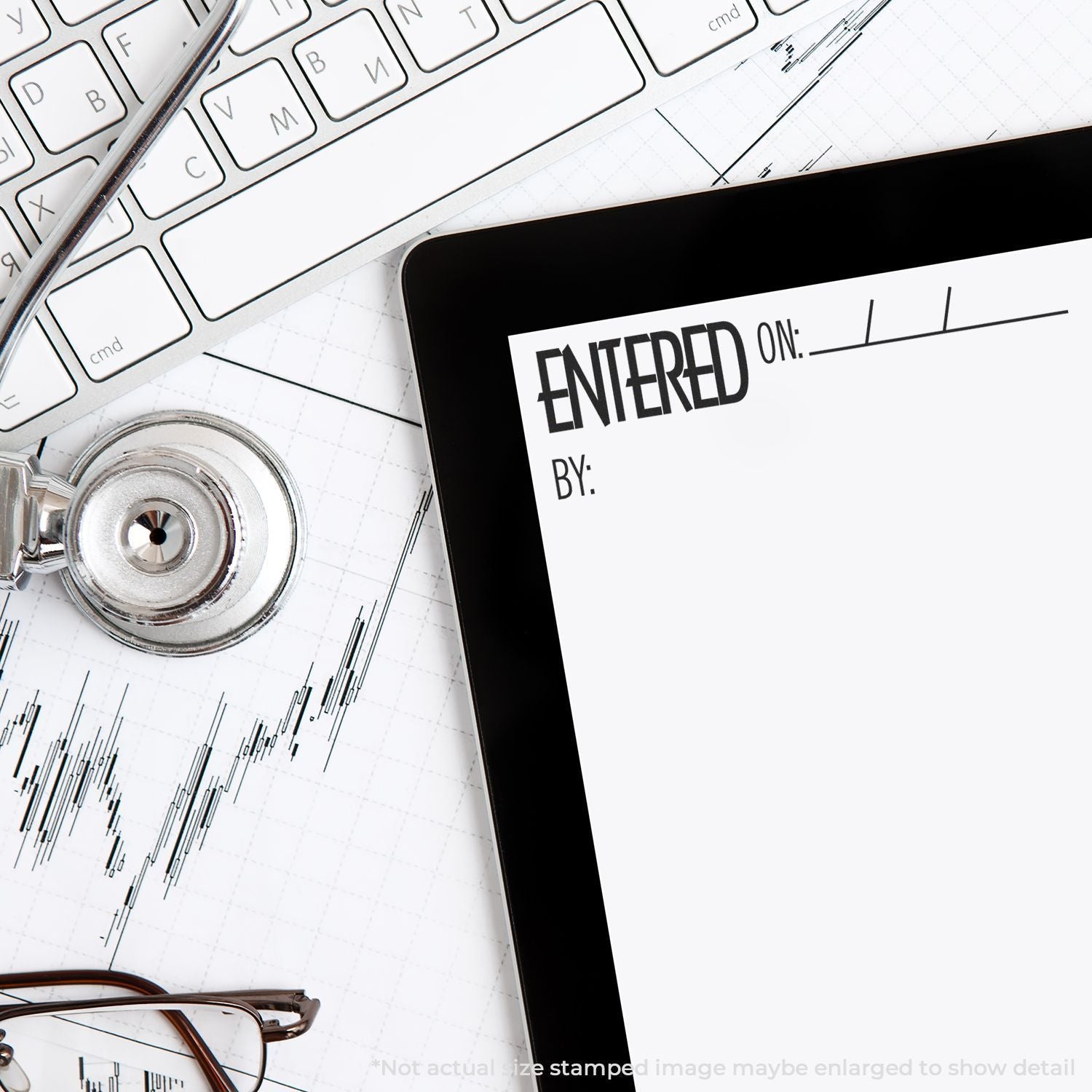 Tablet with entered form on desk, keyboard, eyeglasses, stethoscope, and financial chart concept for business or medical records.