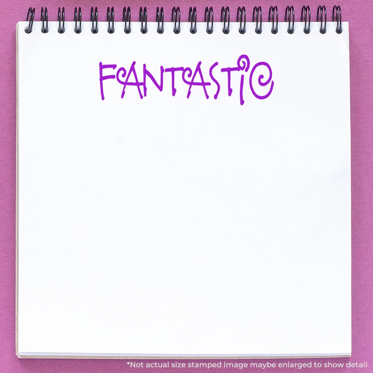 Spiral notebook with purple FANTASTIC lettering on a pink background, blank page template for creative stationery design.