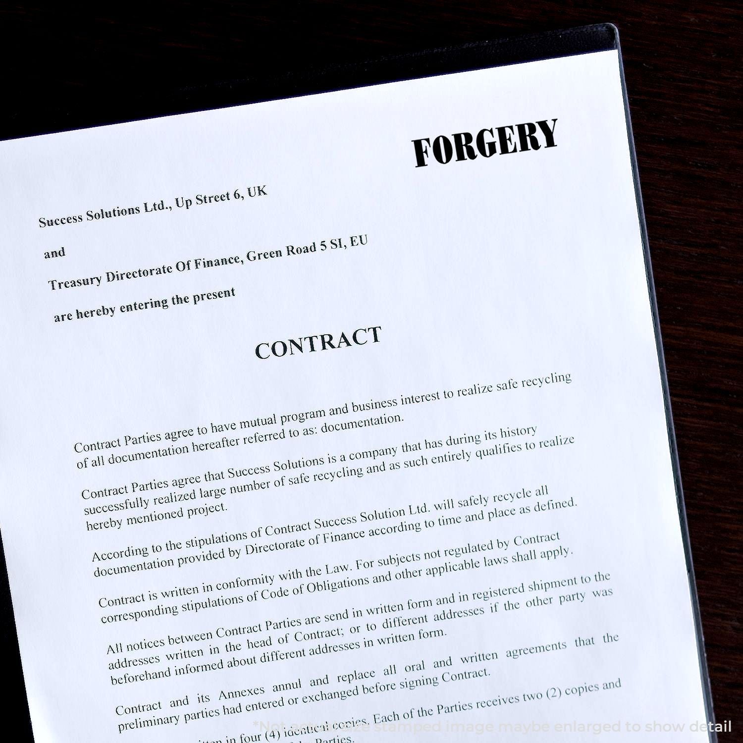 Forged contract document with bold FORGERY stamp on office desk, legal fraud concept image