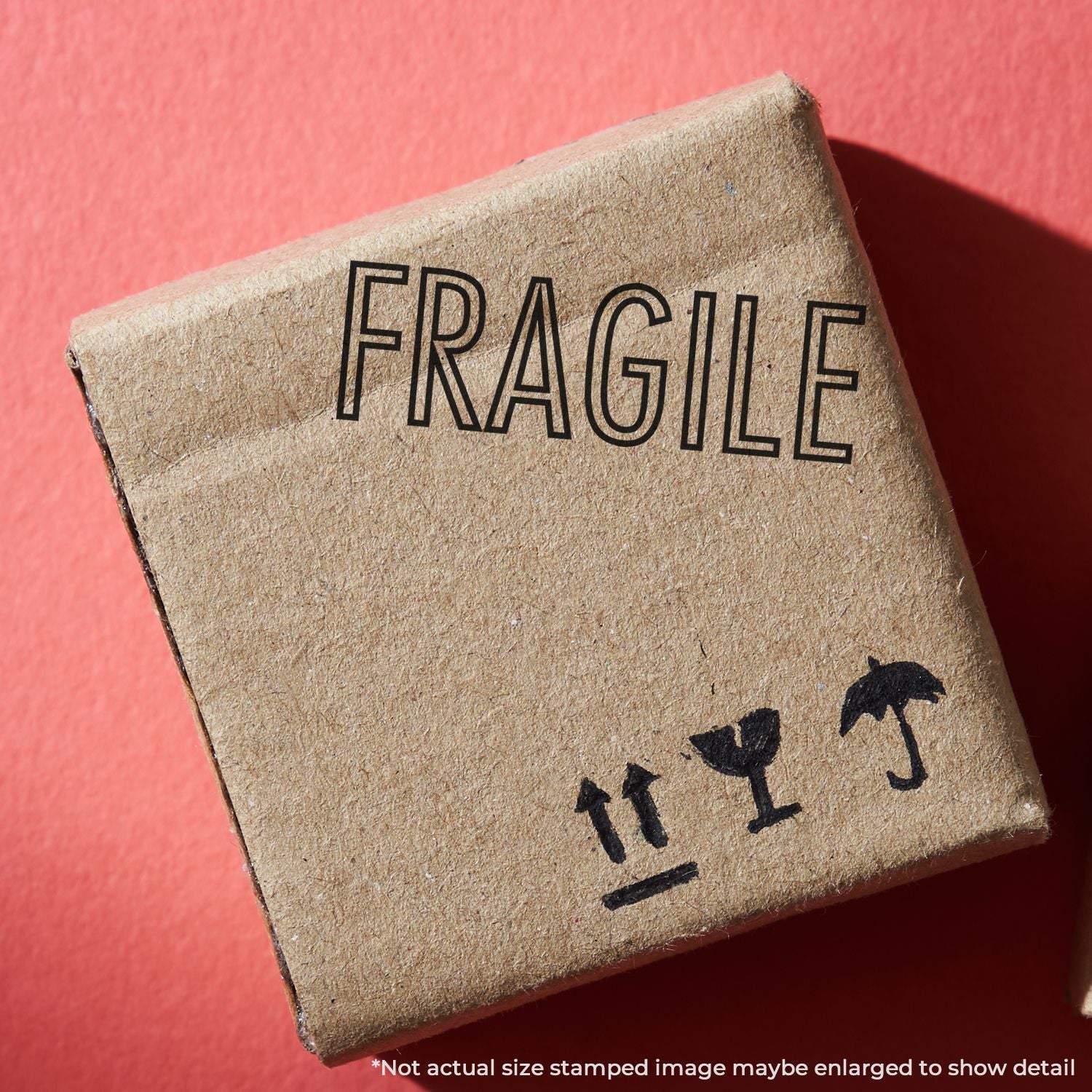Fragile shipping label stamped on cardboard box with handling icons, for safe transport and delivery.