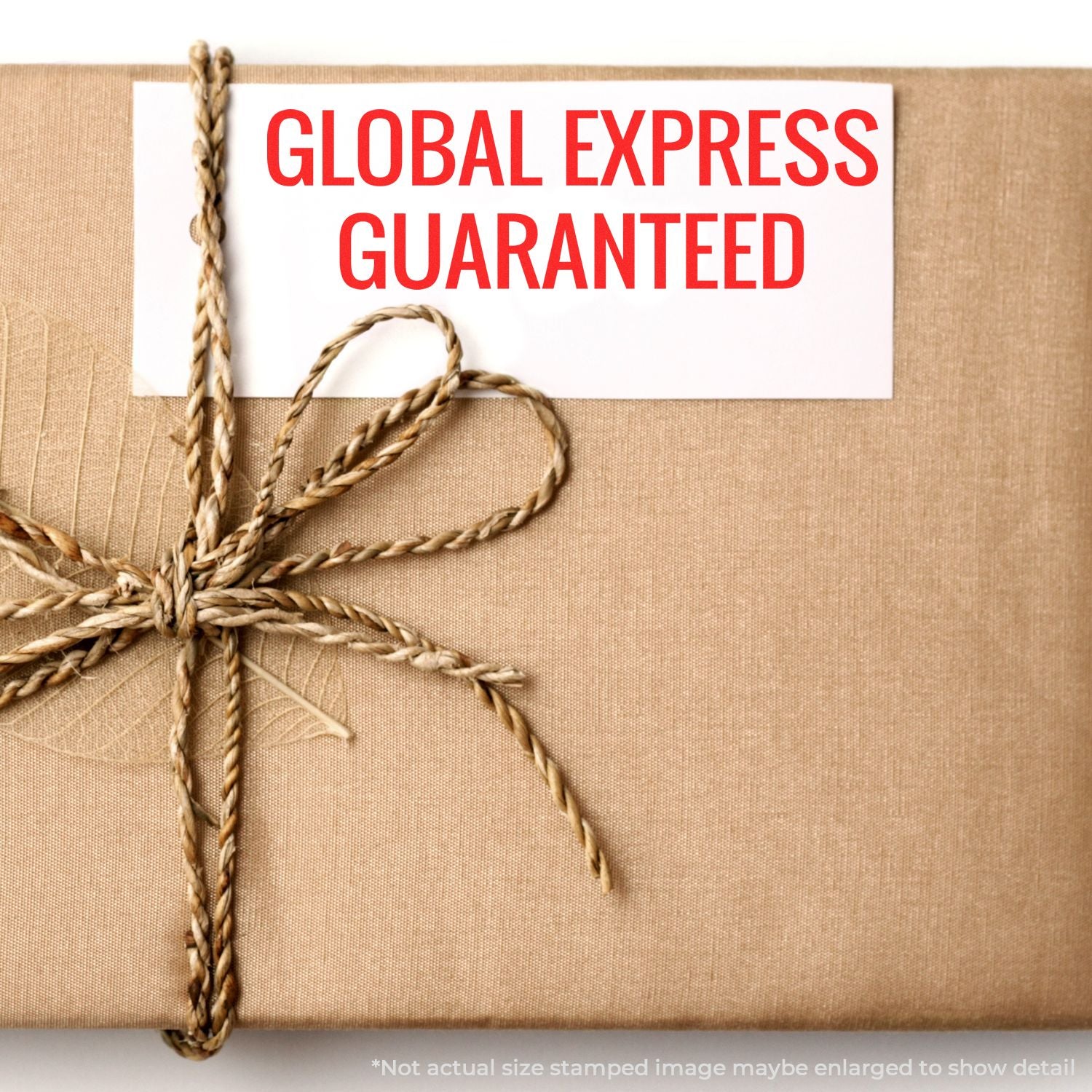 Global Express Guaranteed label on tied shipping box, highlighting guaranteed international delivery service promise.
