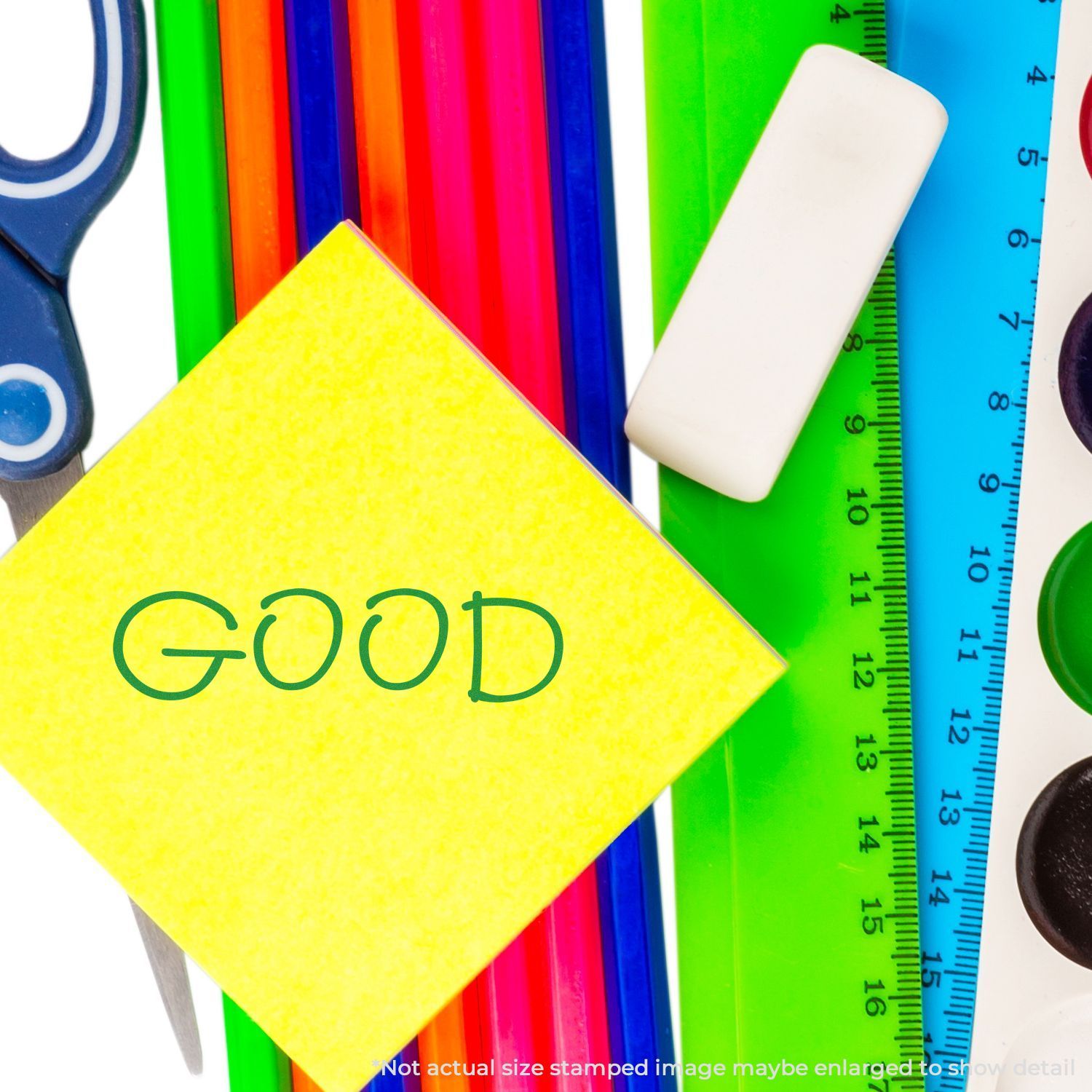Colorful school supplies with a yellow sticky note reading GOOD, including scissors, markers, ruler, and eraser on a white background.