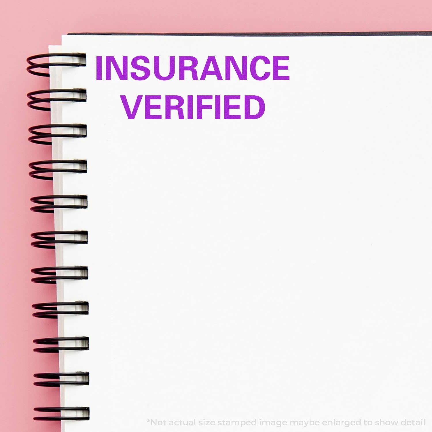 Insurance Verified text on an open notebook page with spiral binding, confirming insurance status and eligibility.