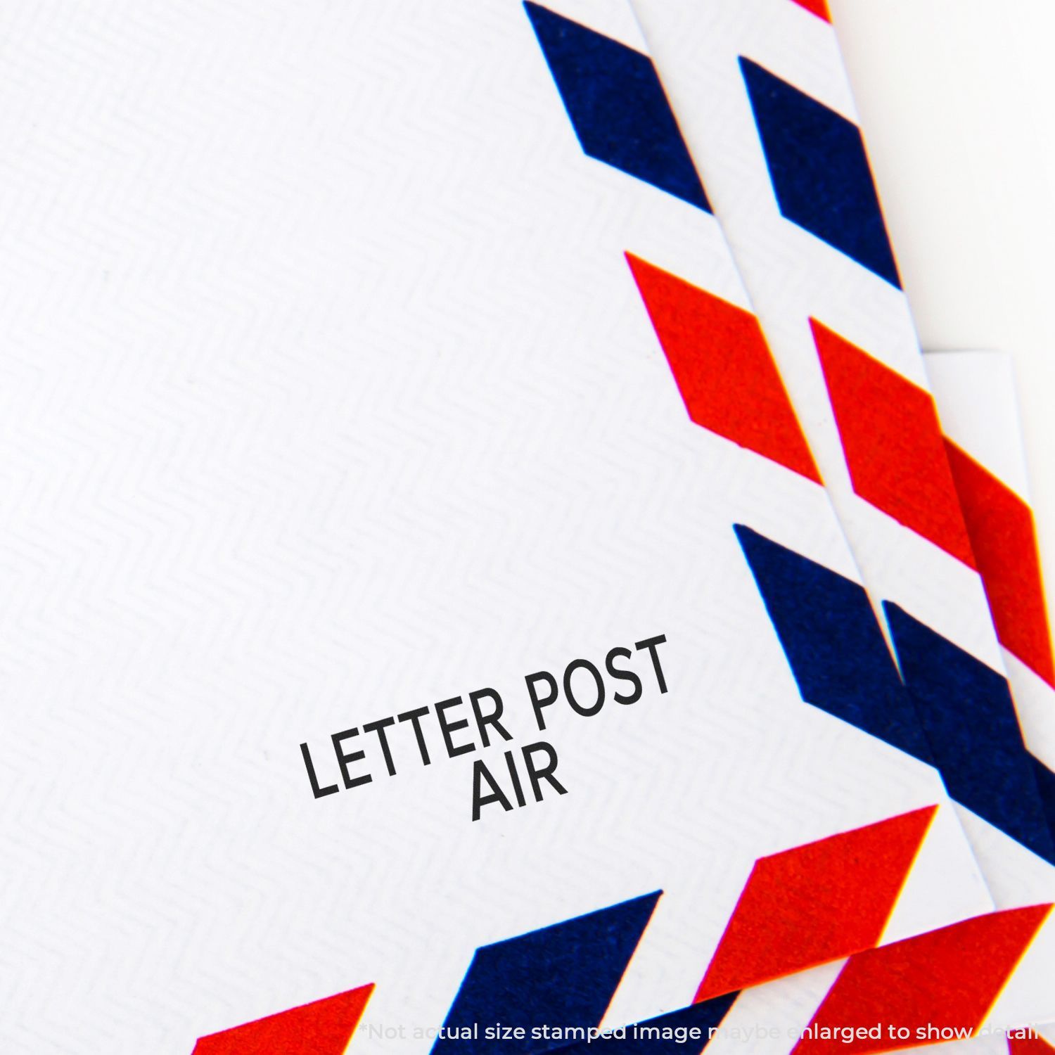 Close-up of Letter Post Air postage stamp for international air mail letters with bold blue and red graphic