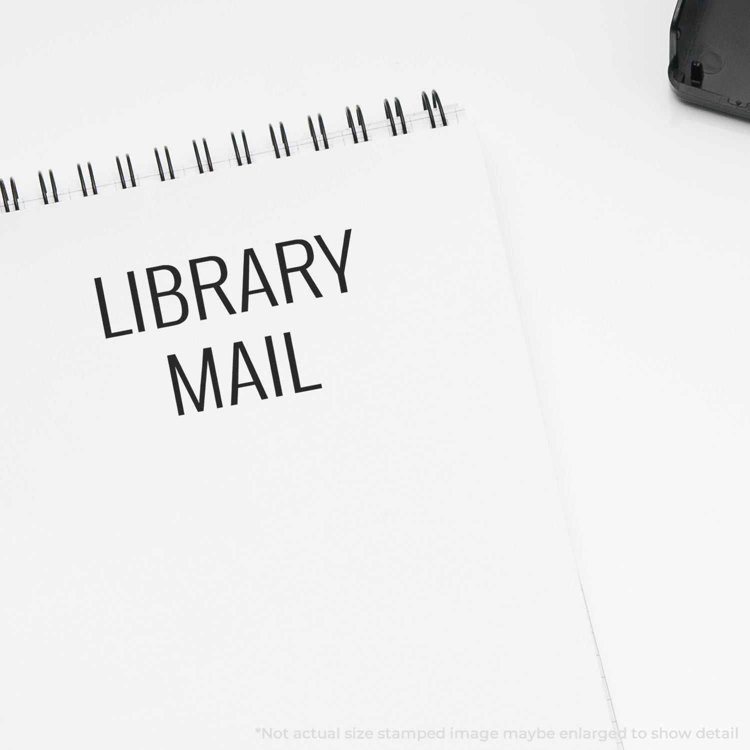 Library Mail notebook page with spiral binding, highlighting library delivery and mail service for documents.